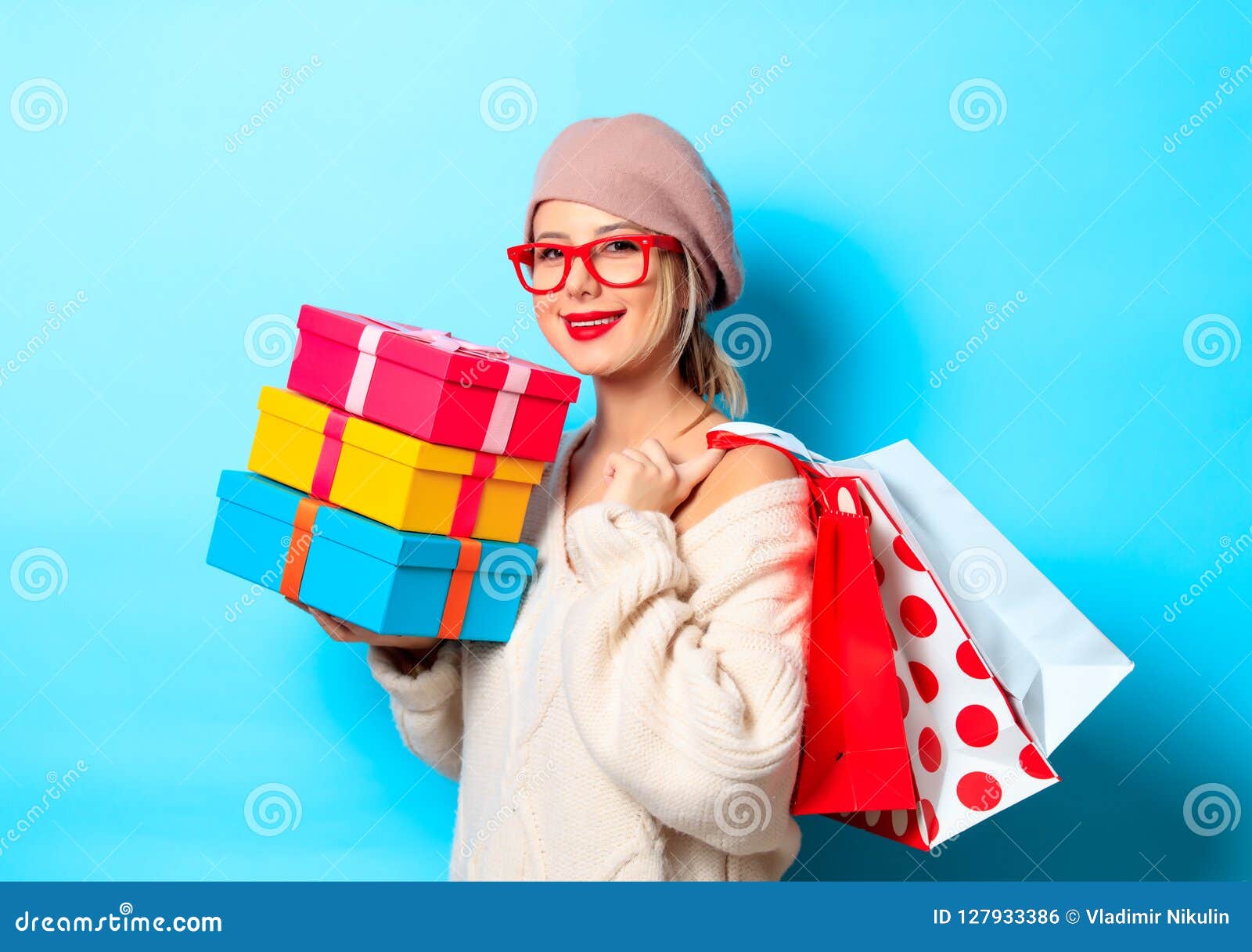 Girl with Gift Boxes and Shopping Bags Stock Photo photo