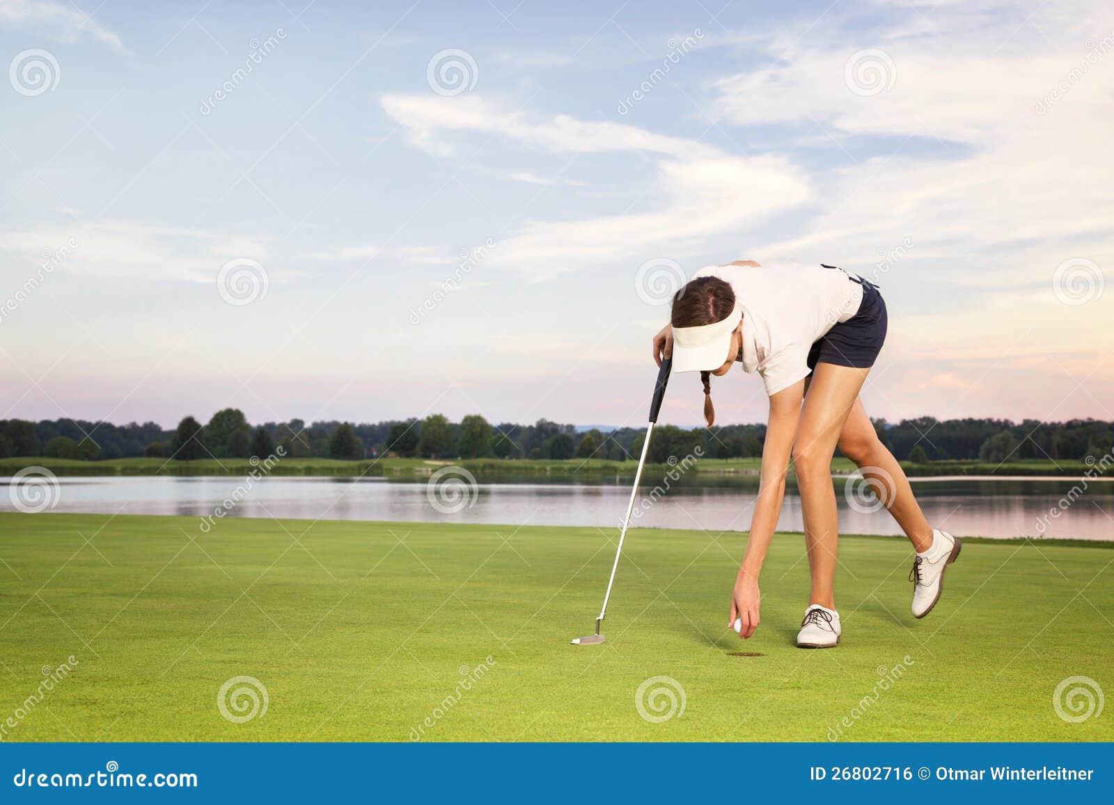 Girl Golf Player Picking Up Ball From Cup. Stock Photo Image 26802716
