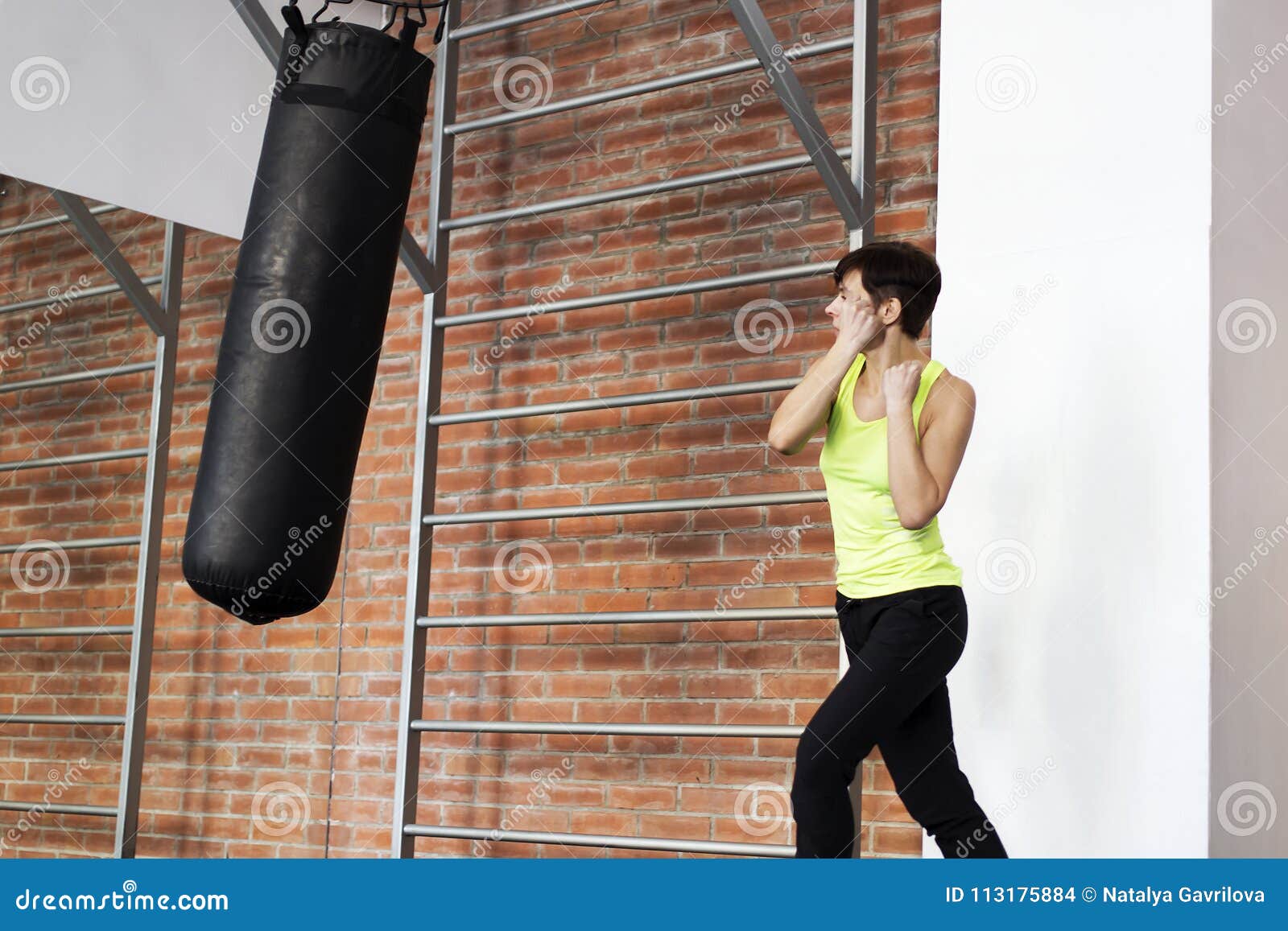 Girl in the Gym Hitting the Punching Bag Stock Photo Image of healthy