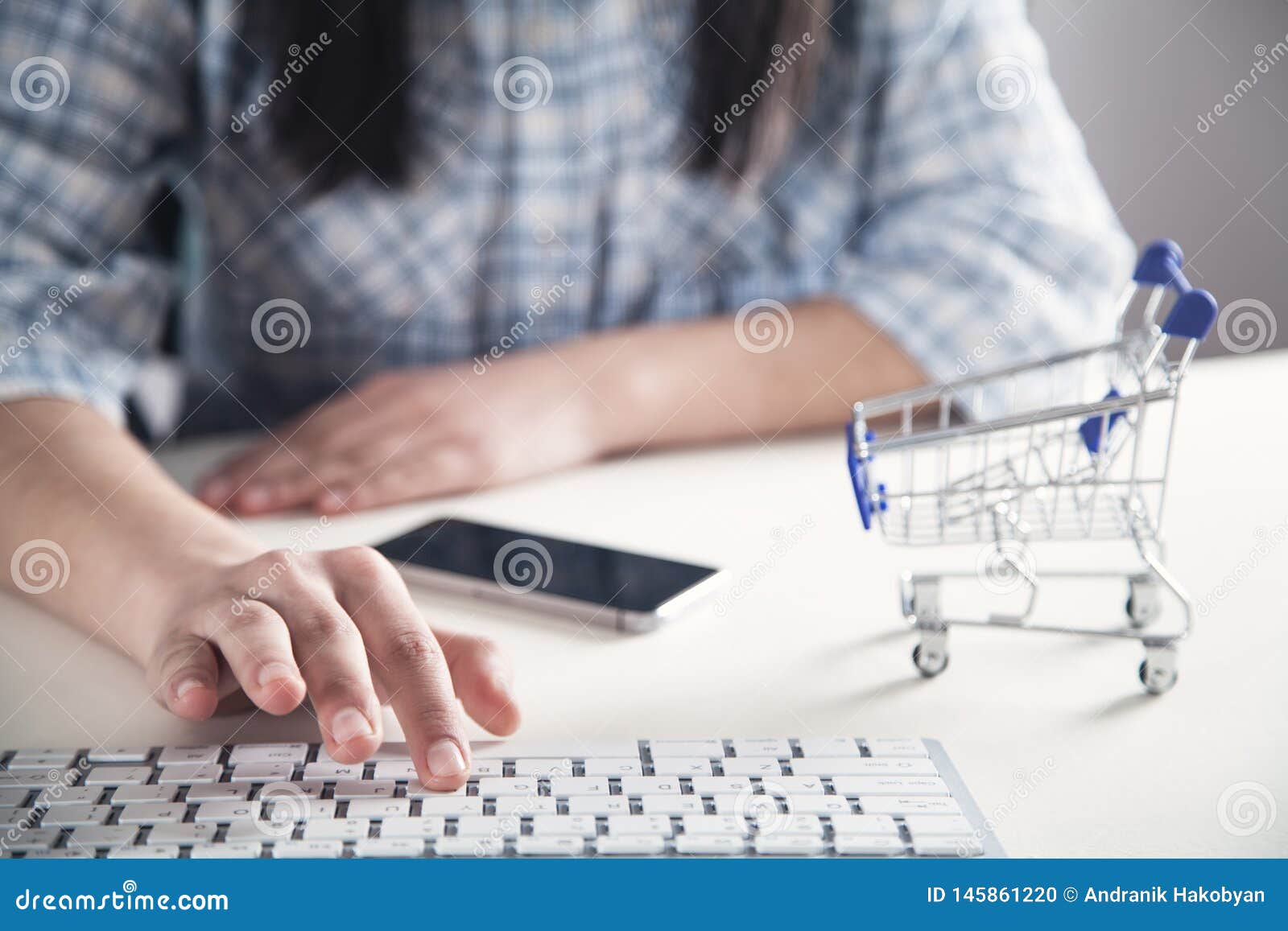 Girl Hand Using Computer Keyboard. Online Shopping Concept Stock Photo