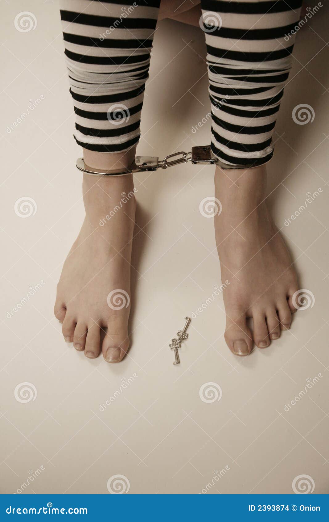 A Depressed Man In Handcuffs Behind Bars A Depressed Arrested Male 