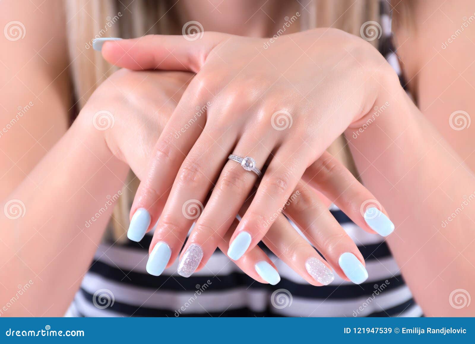 elegance and bliss: blue manicure and diamond rings