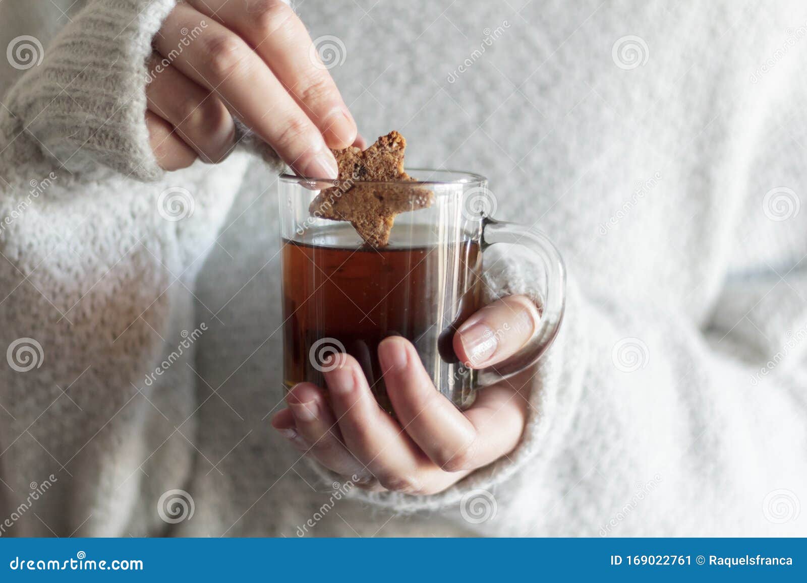 Girl Hands Dipping Cookie in Hot Tea Stock Image Image of glass