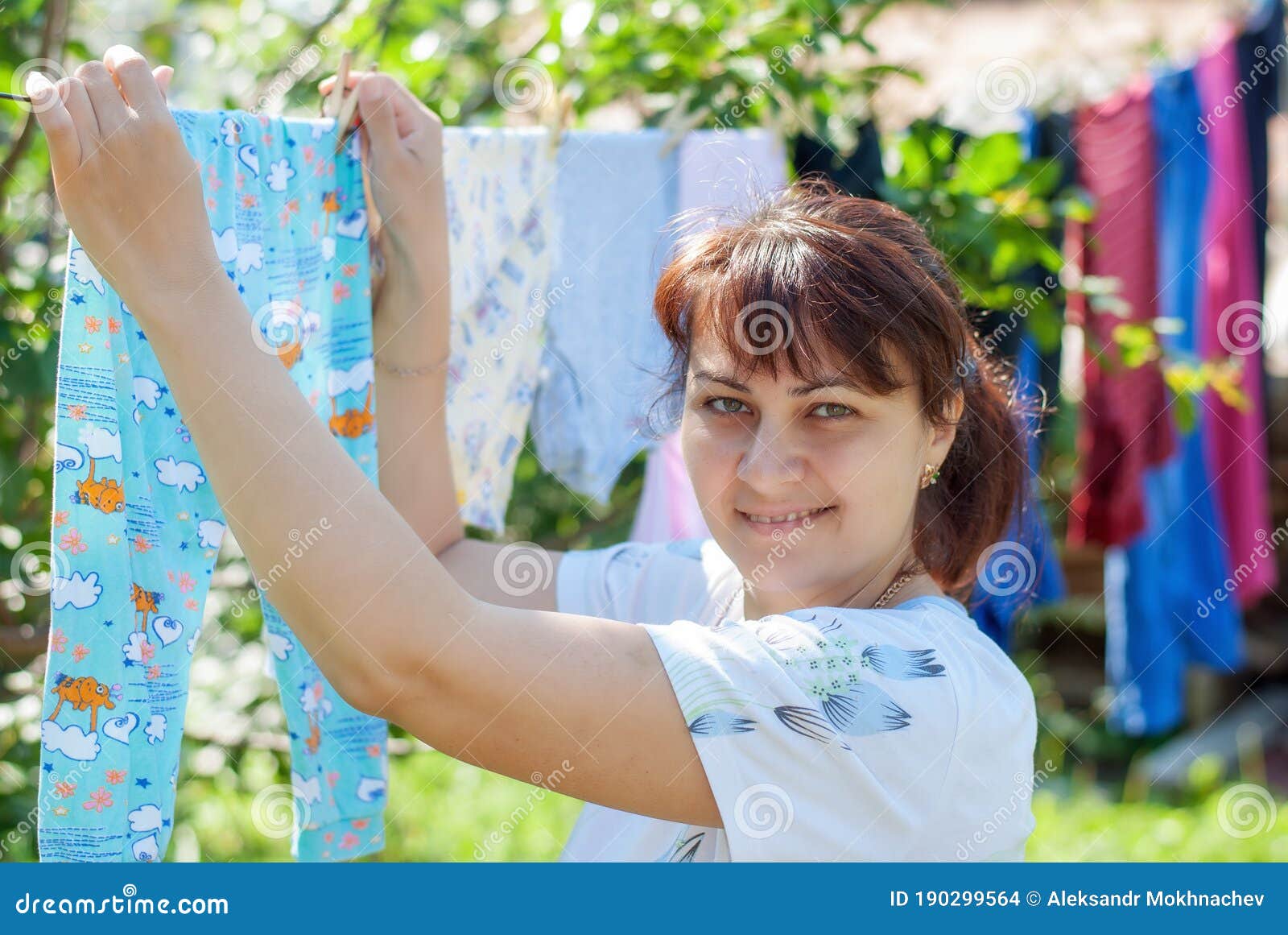 Girl Hanging Clothes on a Rope Stock Photo Image of white, hang
