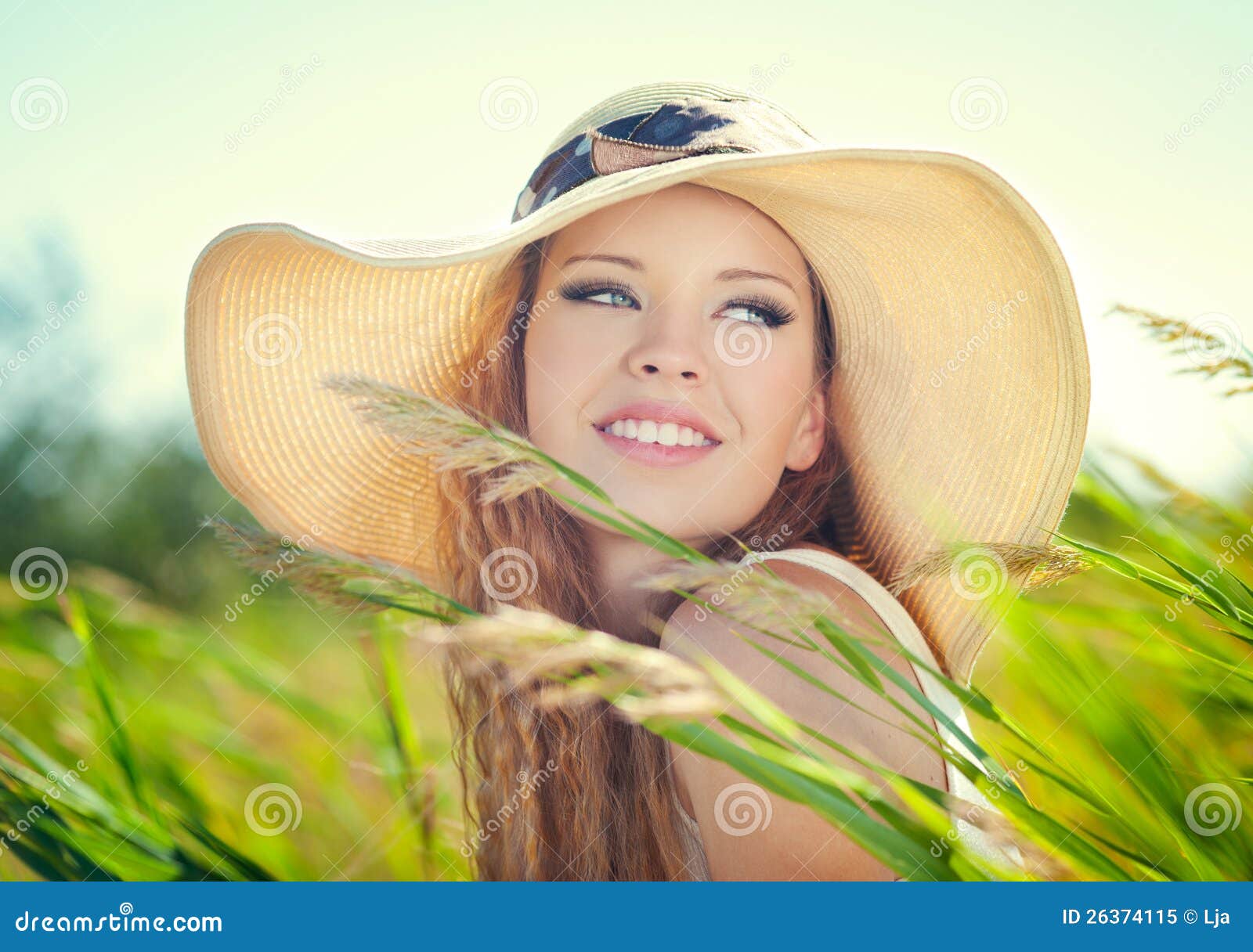 Girl in hat stock image. Image of field, adult, curly 26374115