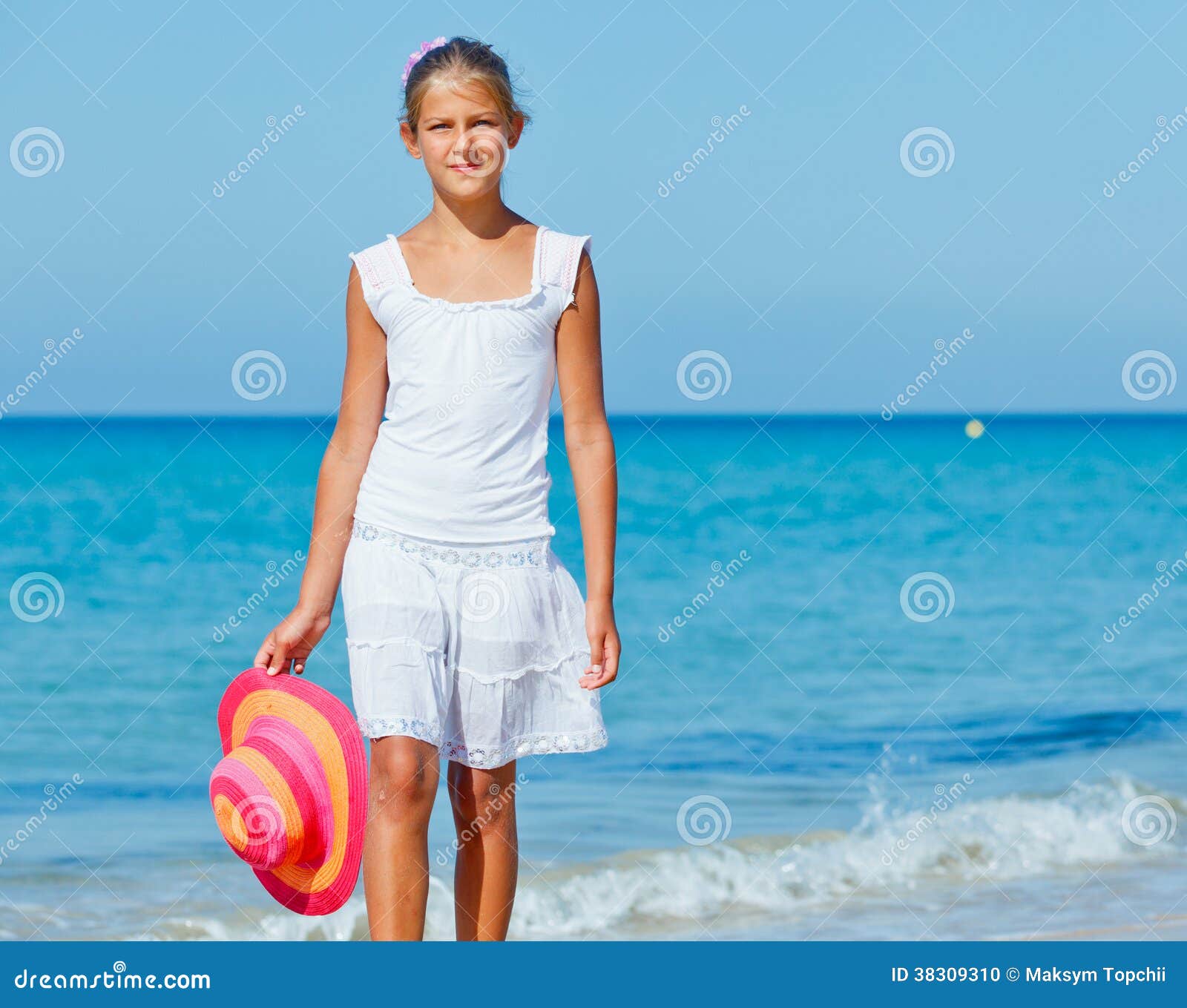 Girl with hat on the beach stock photo. Image of holiday 38309310