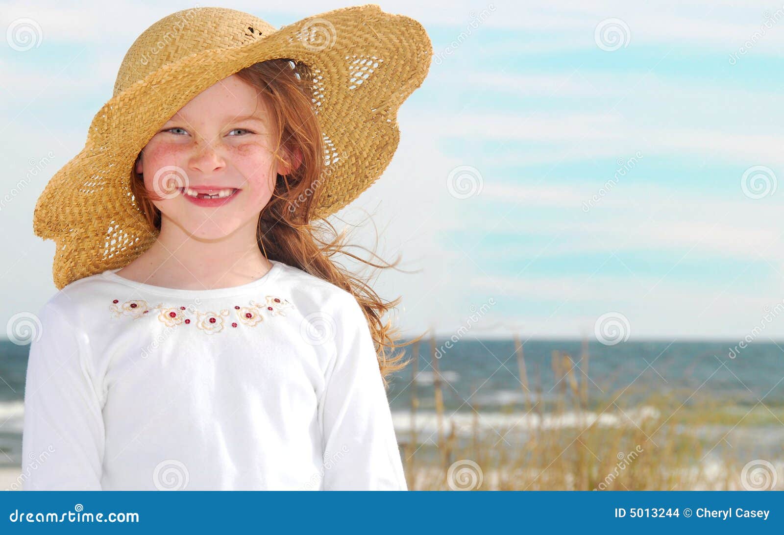 Girl in Hat on Beach stock photo. Image of toothless, breeze 5013244