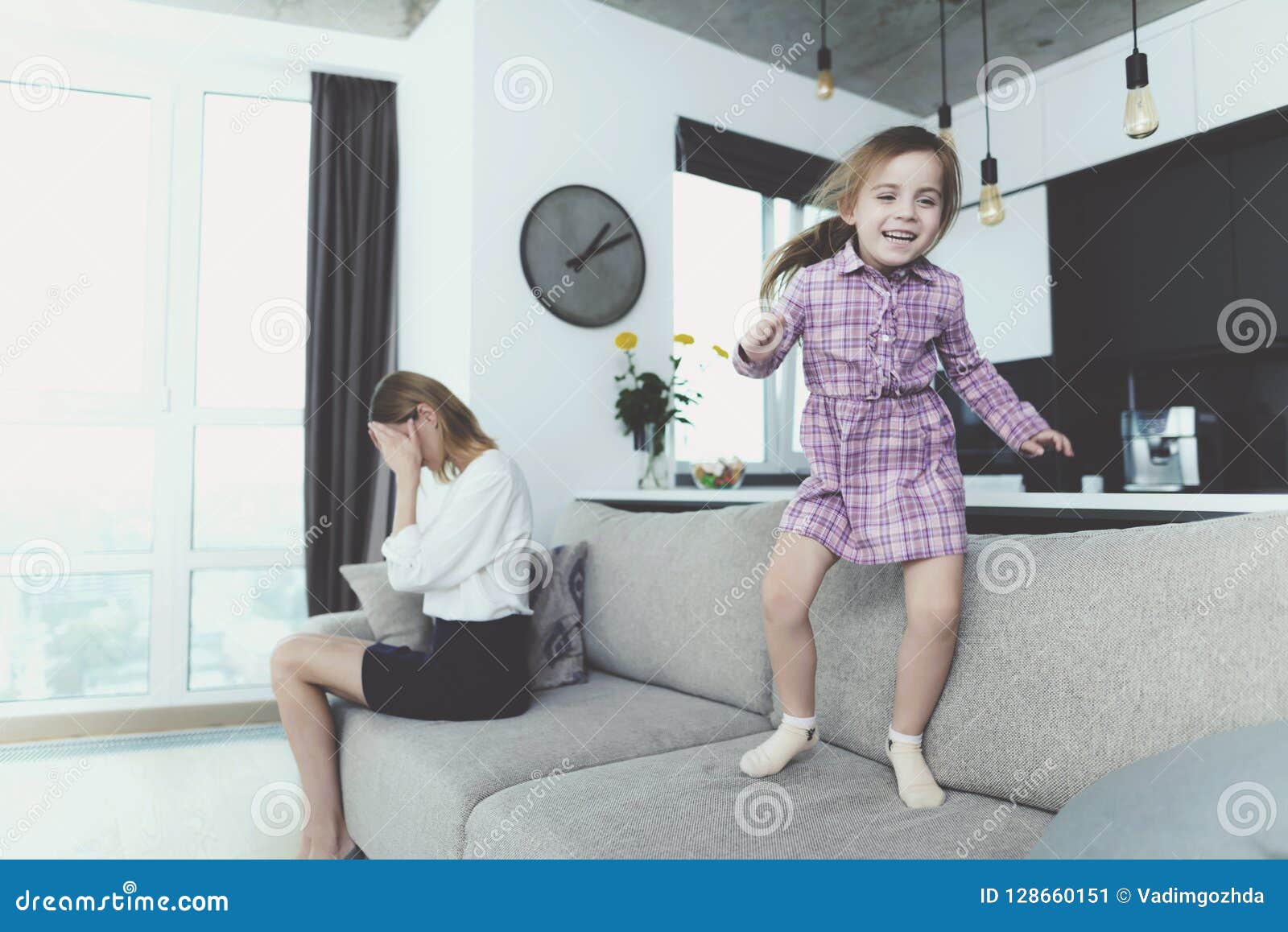 Girl Having Fun Jumping on Sofa when Mother Upset Stock Image - Image ...