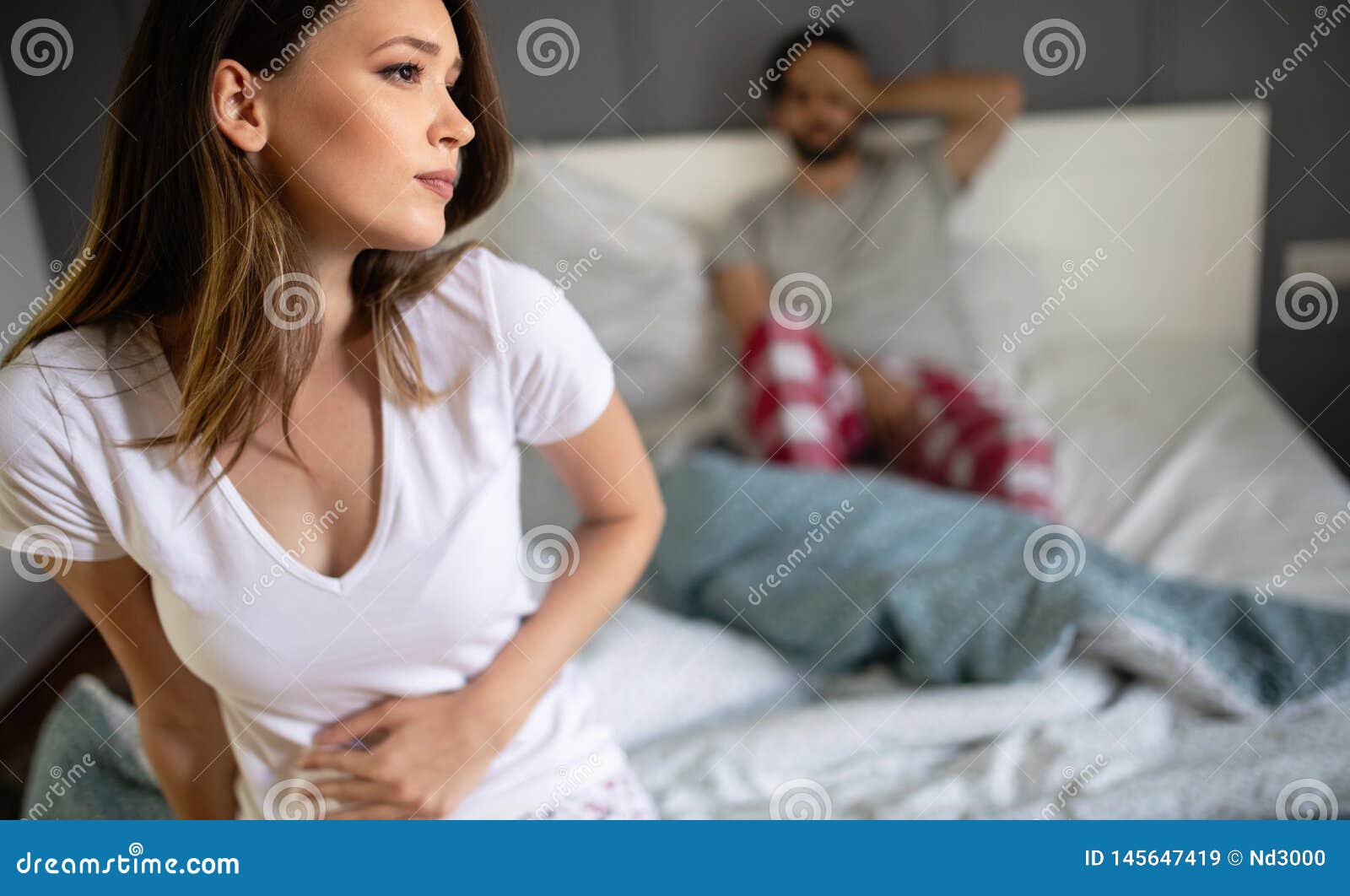 girl having menstruation suffering from menstrual pain