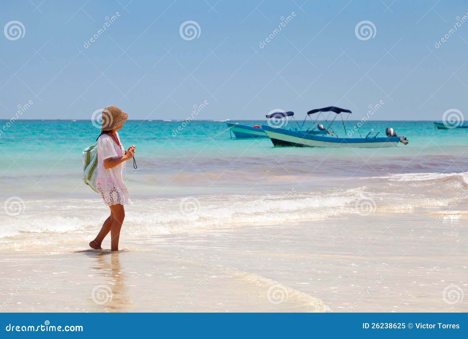 girl having a walk in playa paraiso, mayan riviera