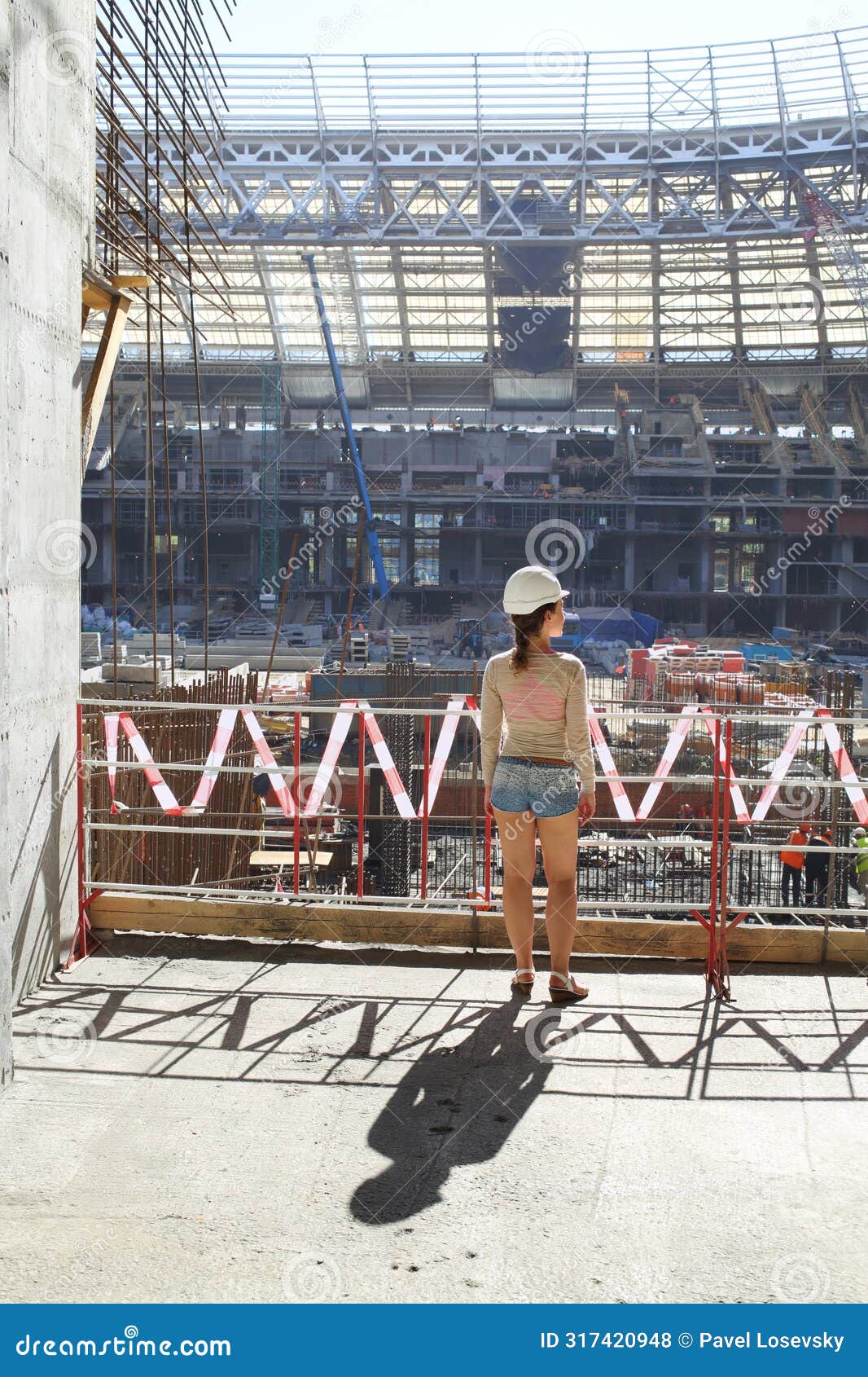 girl in a helmet watching reconstruction of