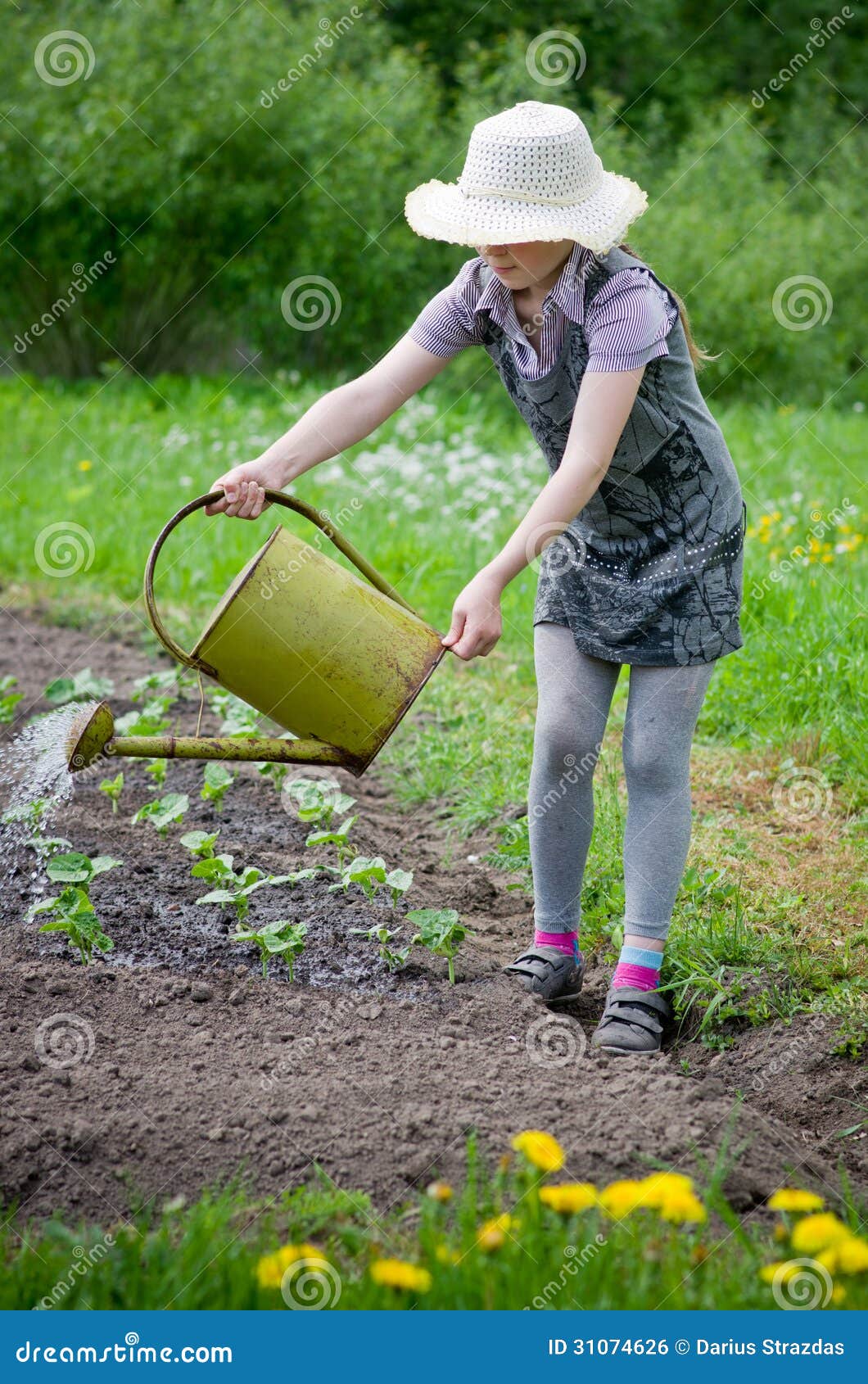 girl helps pours garden