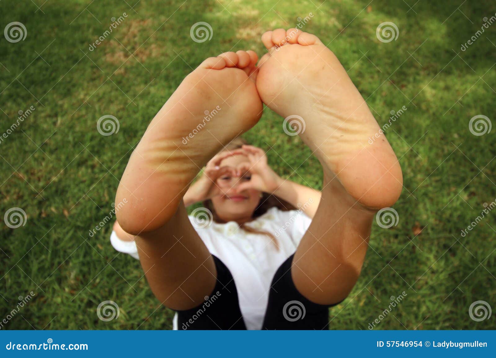 girl with her feet toether in the air