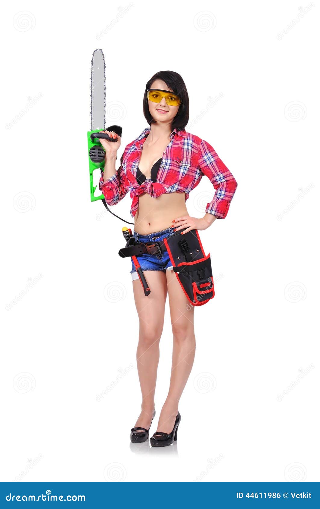 Girl holding chainsaw stock photo. 