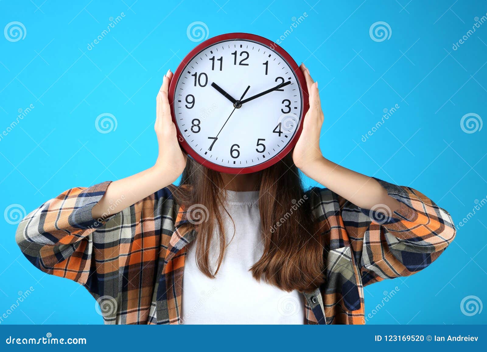 Girl holding a clock stock photo. Image of beauty, hand 123169520