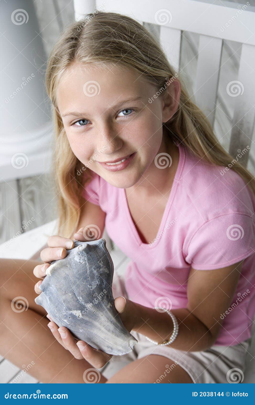 Girl Holding Conch Shell St