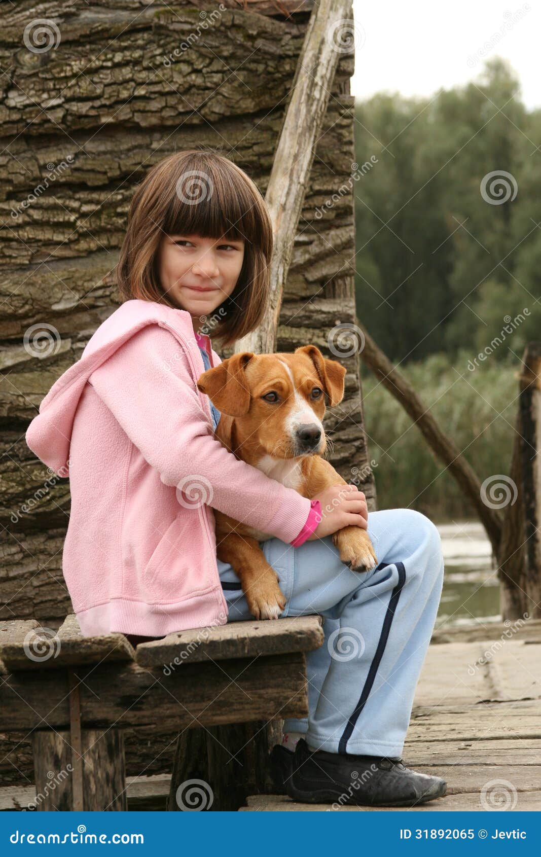 Girl Holding A Dog Royalty Free Stock Photo - Image: 31892065