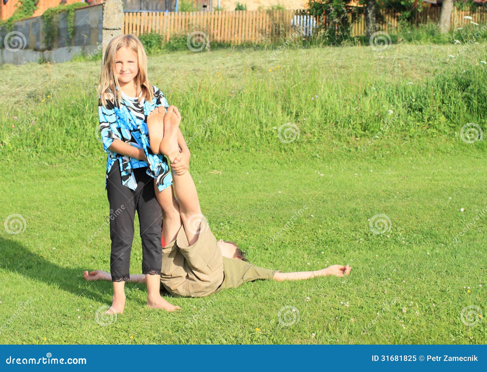 https://thumbs.dreamstime.com/z/girl-holding-feet-boy-barefoot-blue-black-white-t-shirt-bare-green-t-shir-shorts-green-grass-31681825.jpg