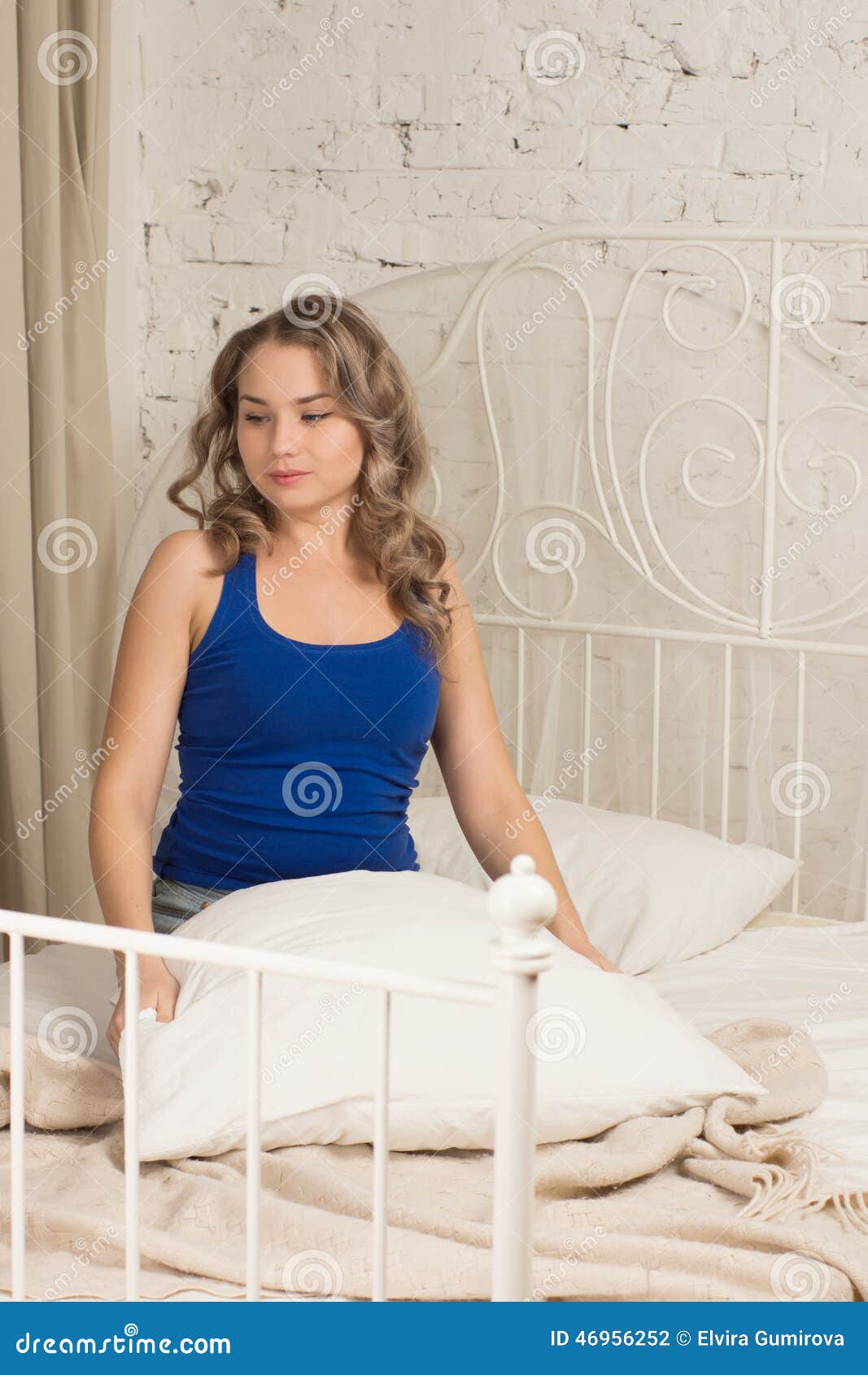 Girl holding a pillow stock photo. Image of vacation 46956252
