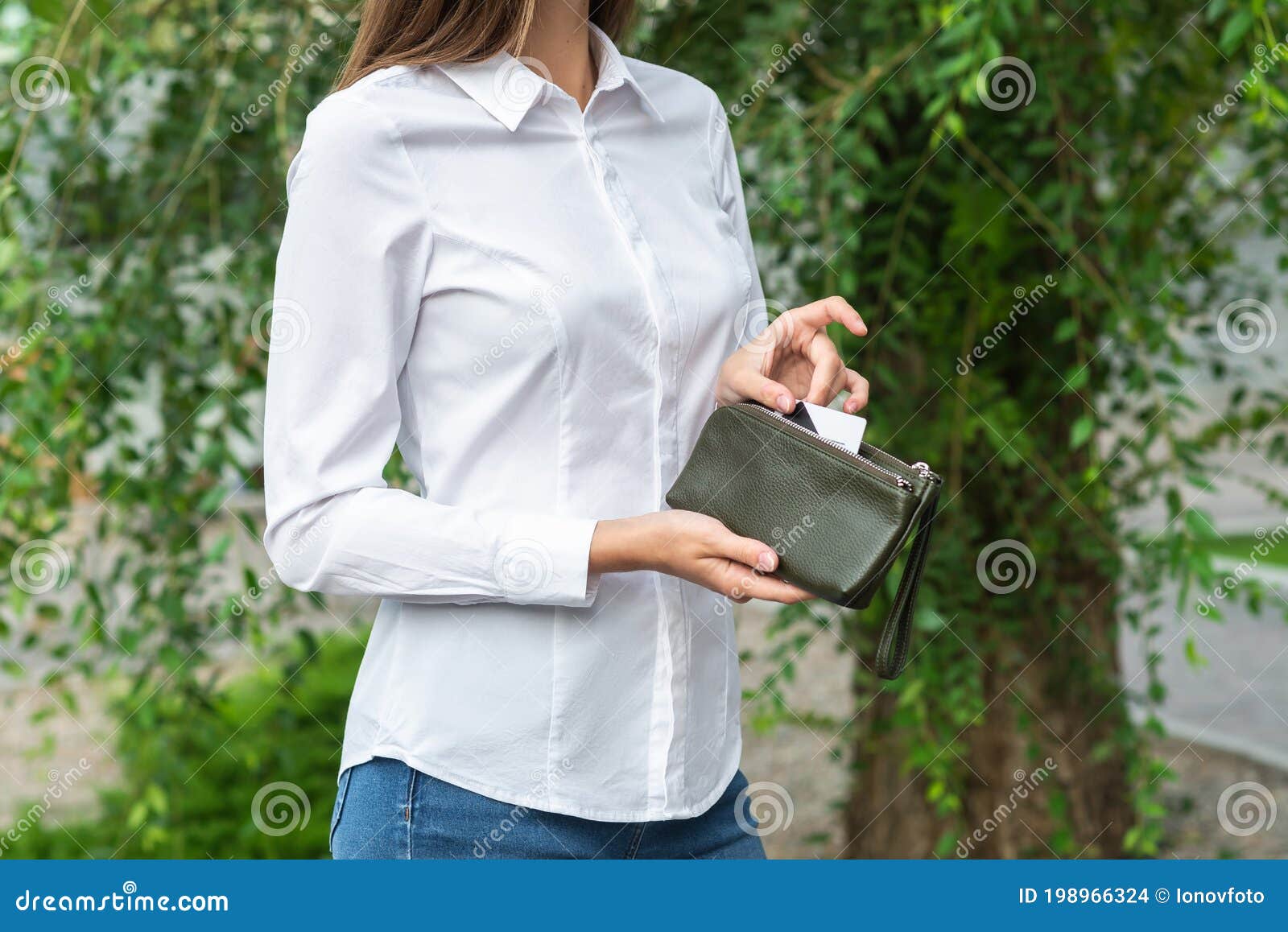 A Girl Holding a Purse in Her Hand Stock Photo Image of fashion