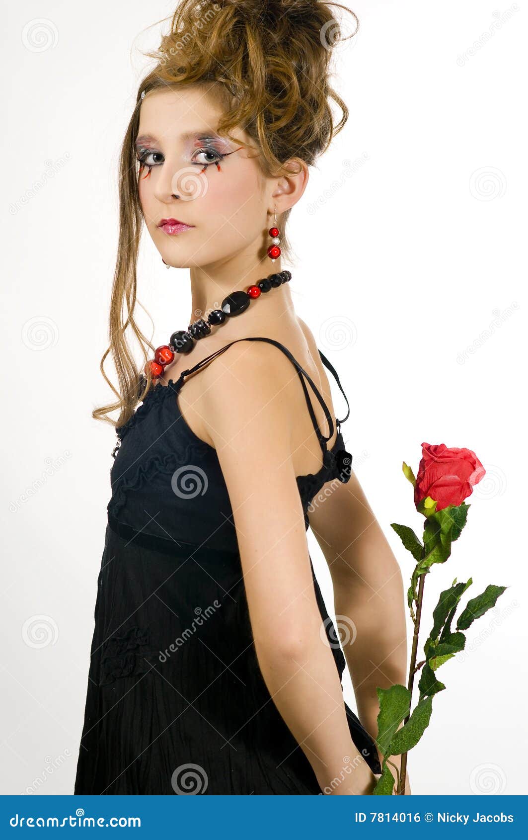 girl holding a red rose