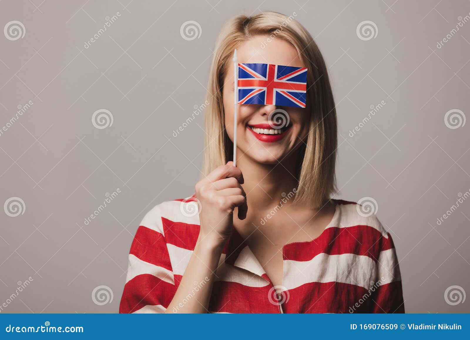 Girl Holds British Flag on Gray Background Stock Image - Image of ...
