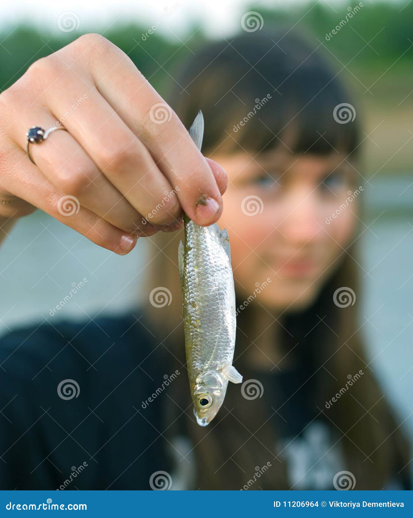 Girl Holds the First Caught Fish in a Hand Stock Photo Image of