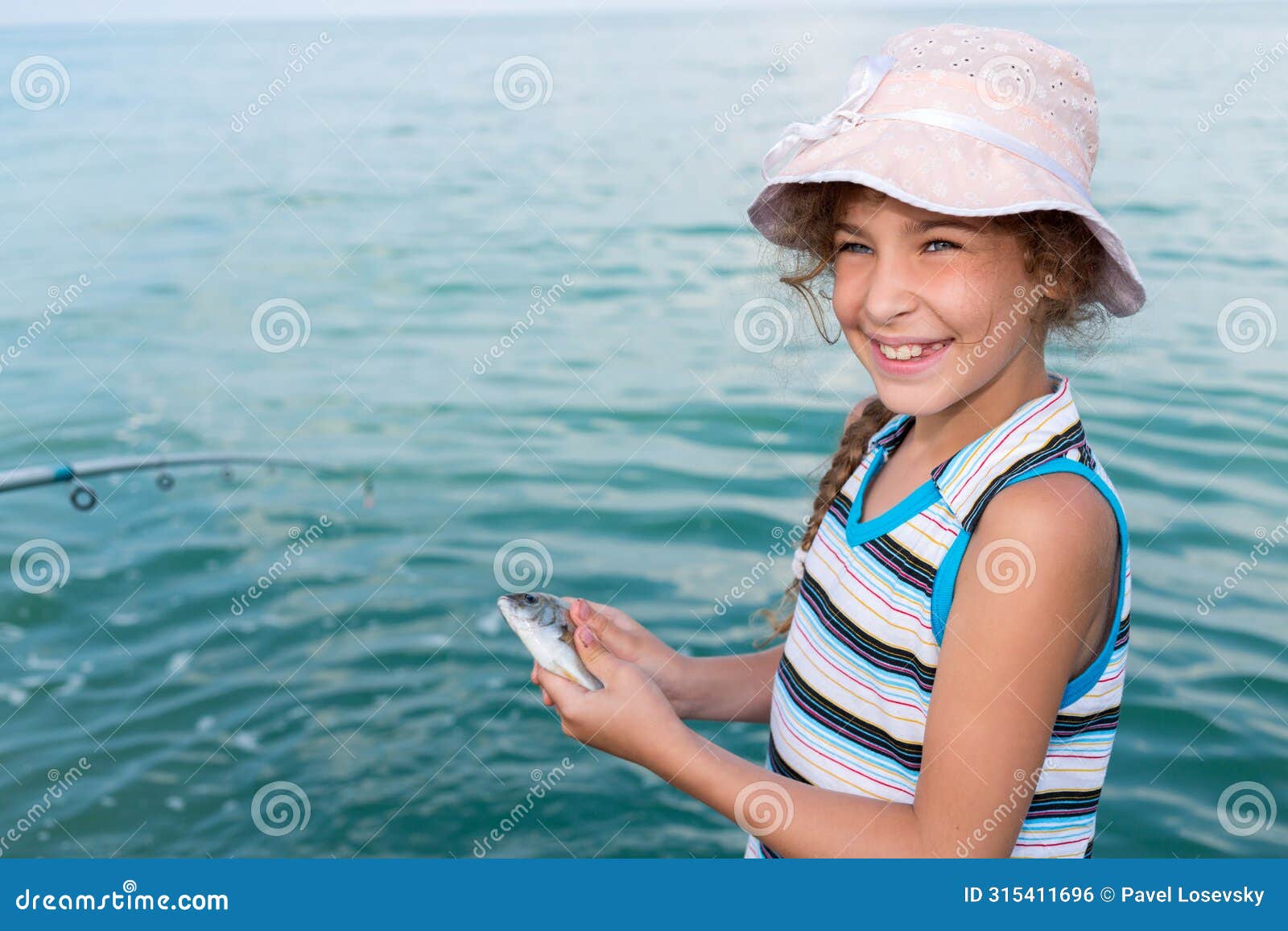 girl holds in hands freshly caught