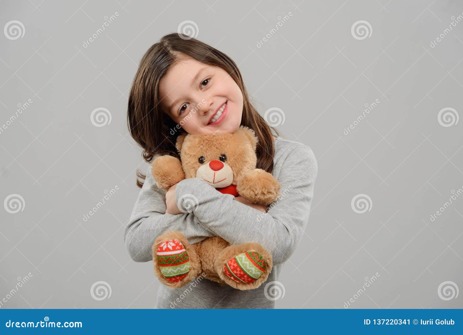 Girl Hugging Teddy Bear