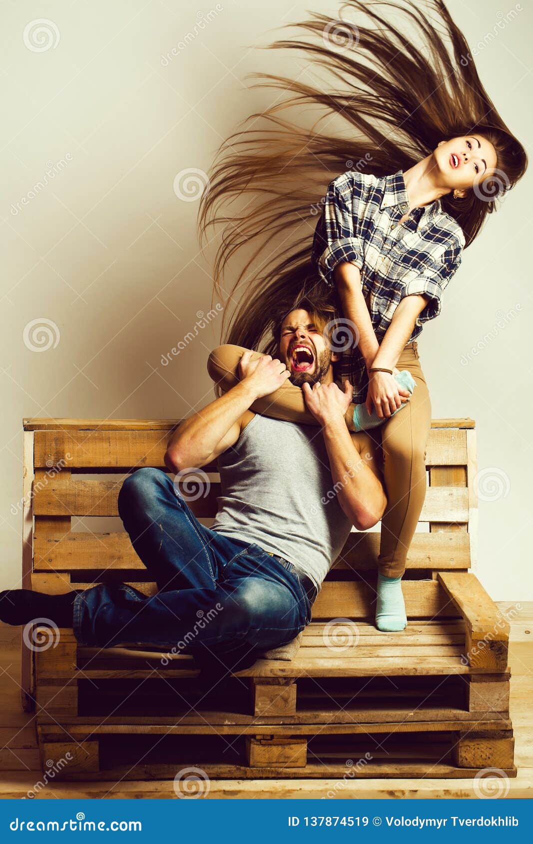 Girl hugs man with leg stock image. Image of long, pallet 137874519