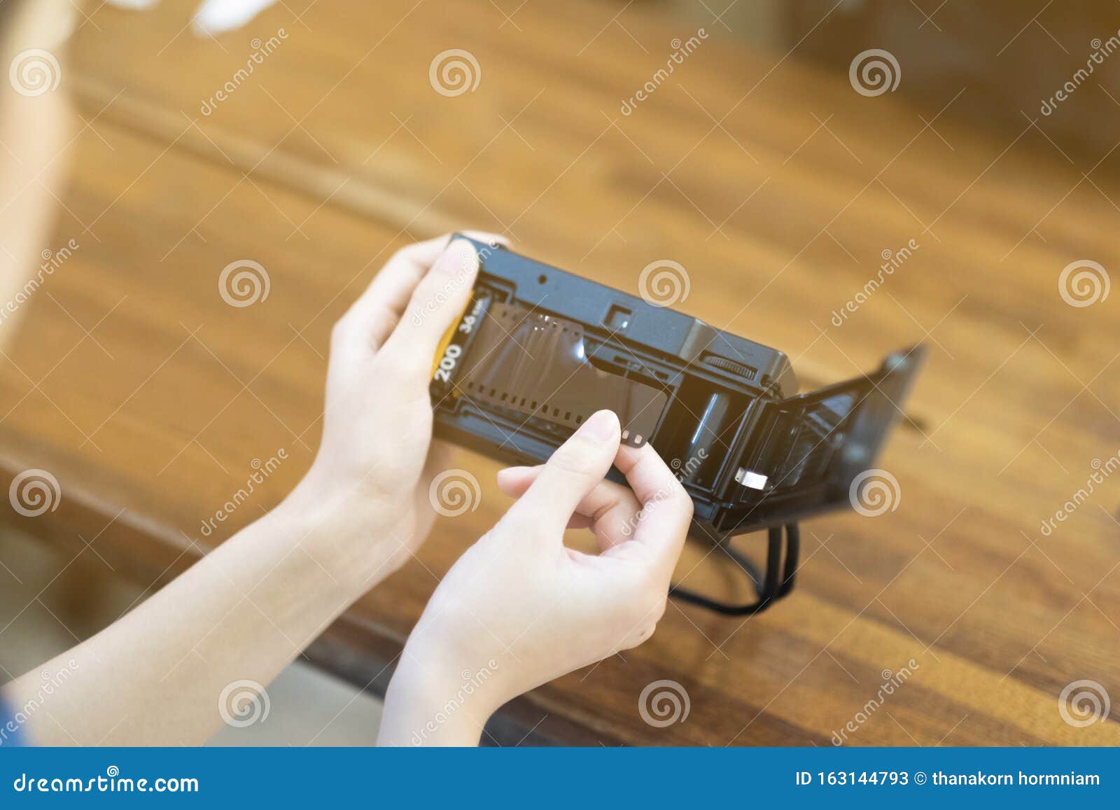 A Girl Insert Film Roll in To the Film Camera Stock Image Image of