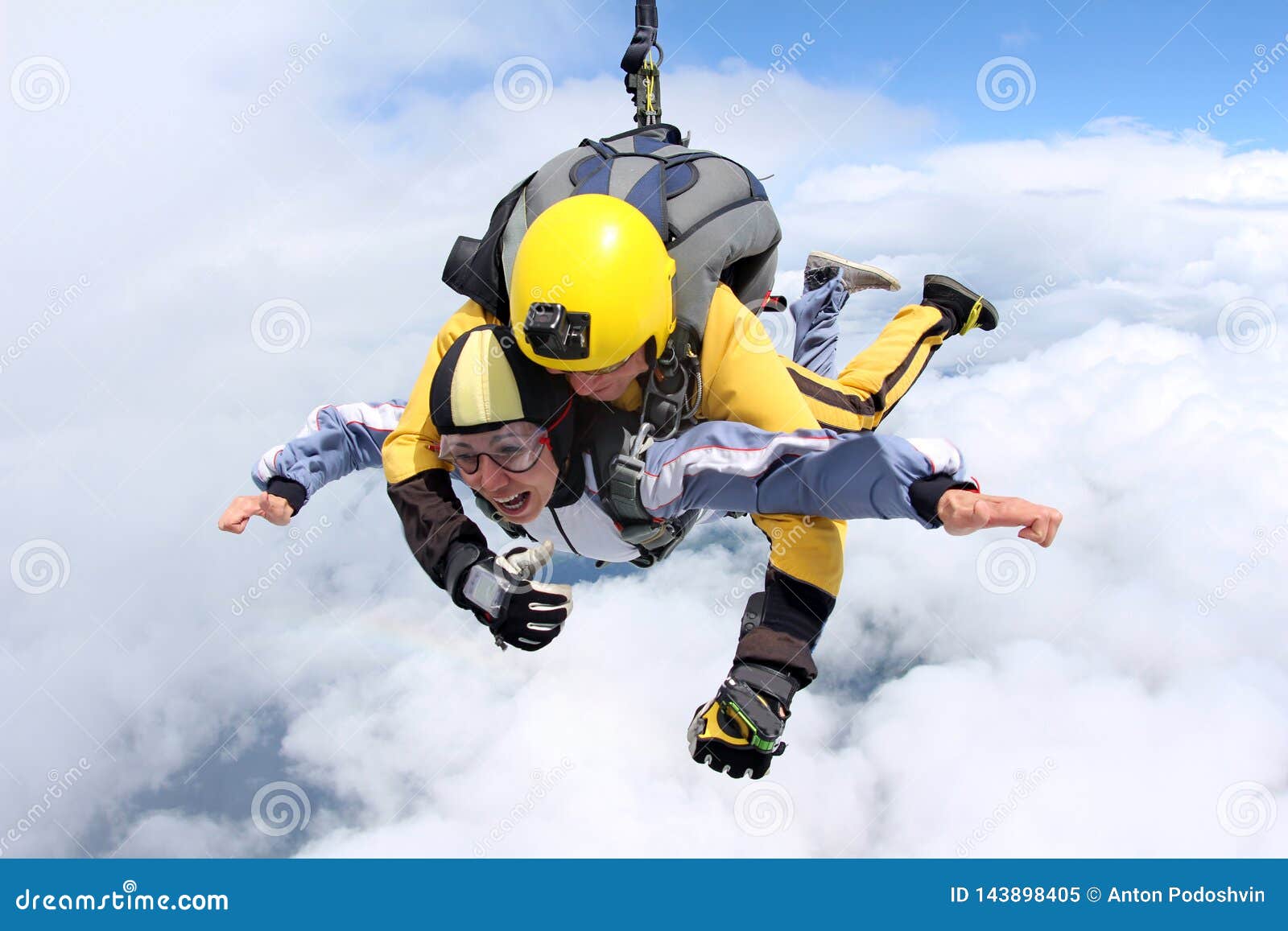 tandem jump. skydiving in the blue sky.