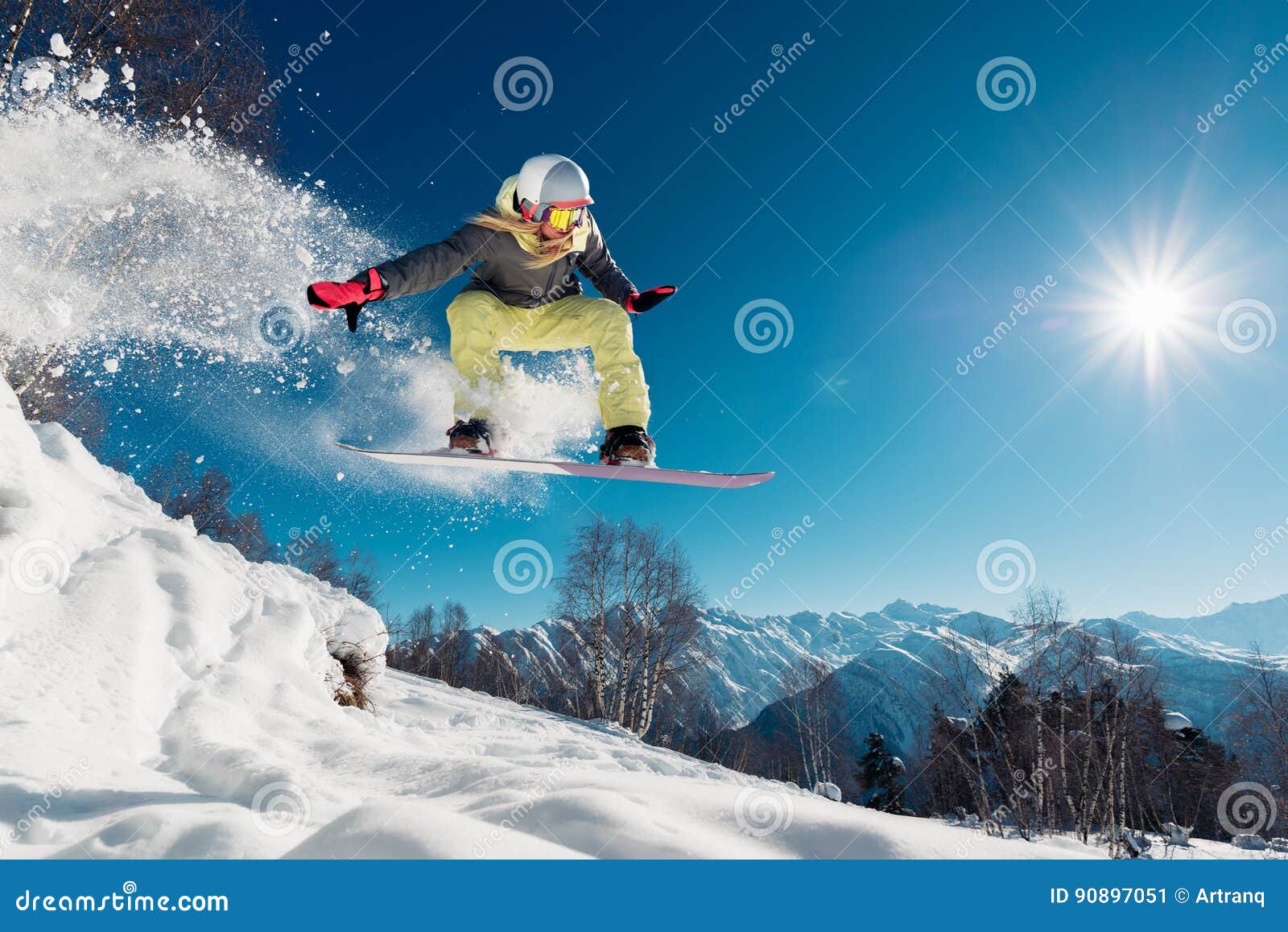girl is jumping with snowboard