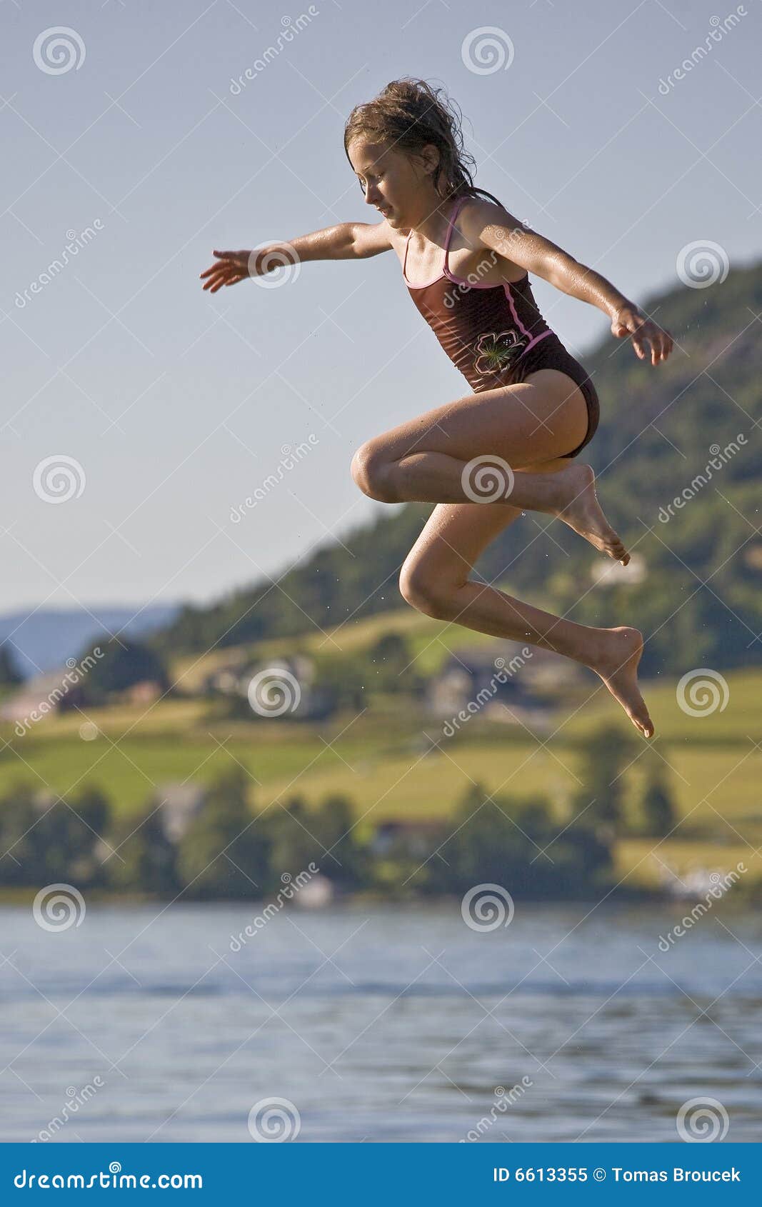 Girl Jumping To Lake, Norway Stock Image - Image of girl, quick