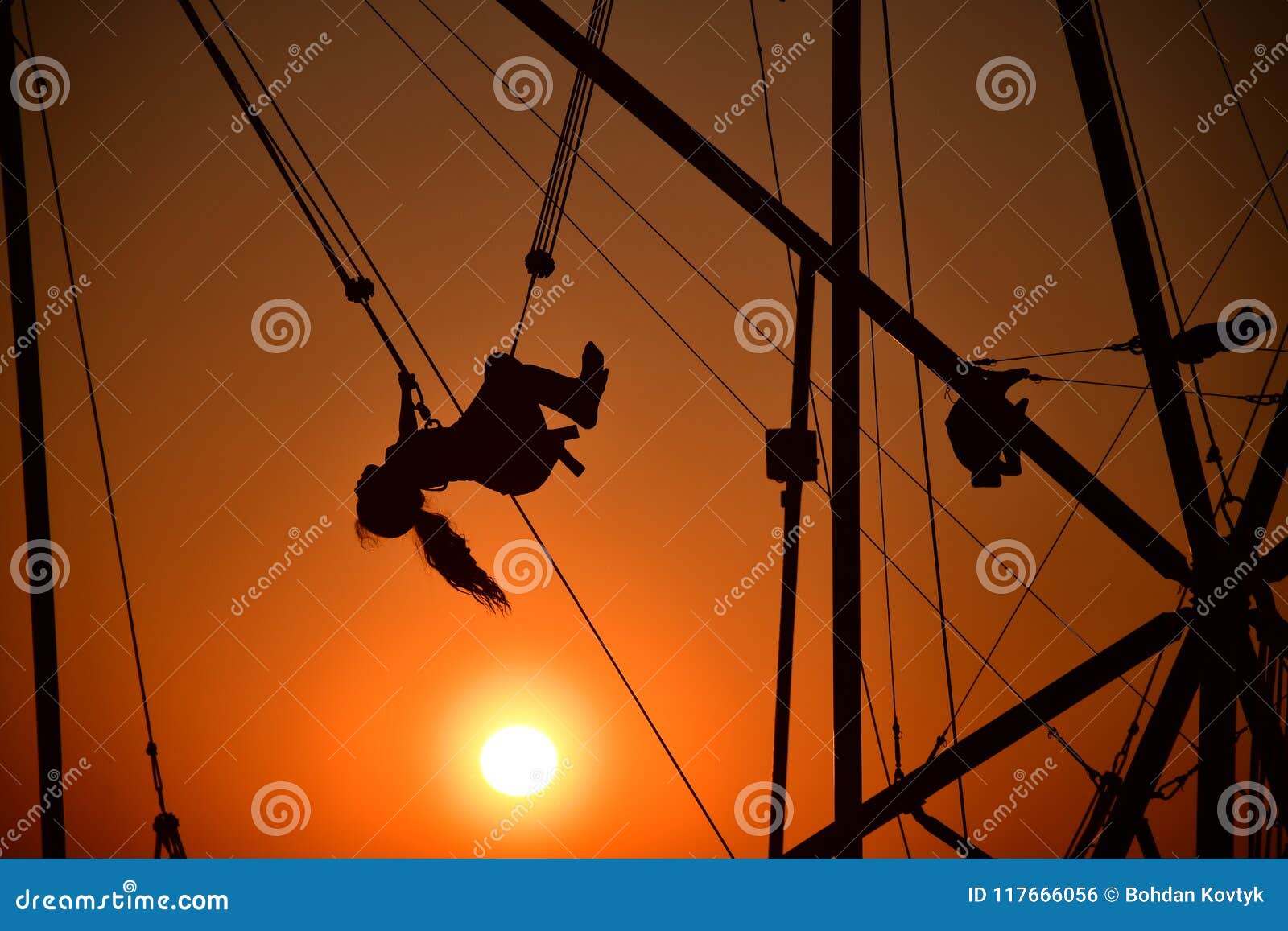 Girl Jumping on the Trampoline in Front of the Sun Stock Photo - Image ...