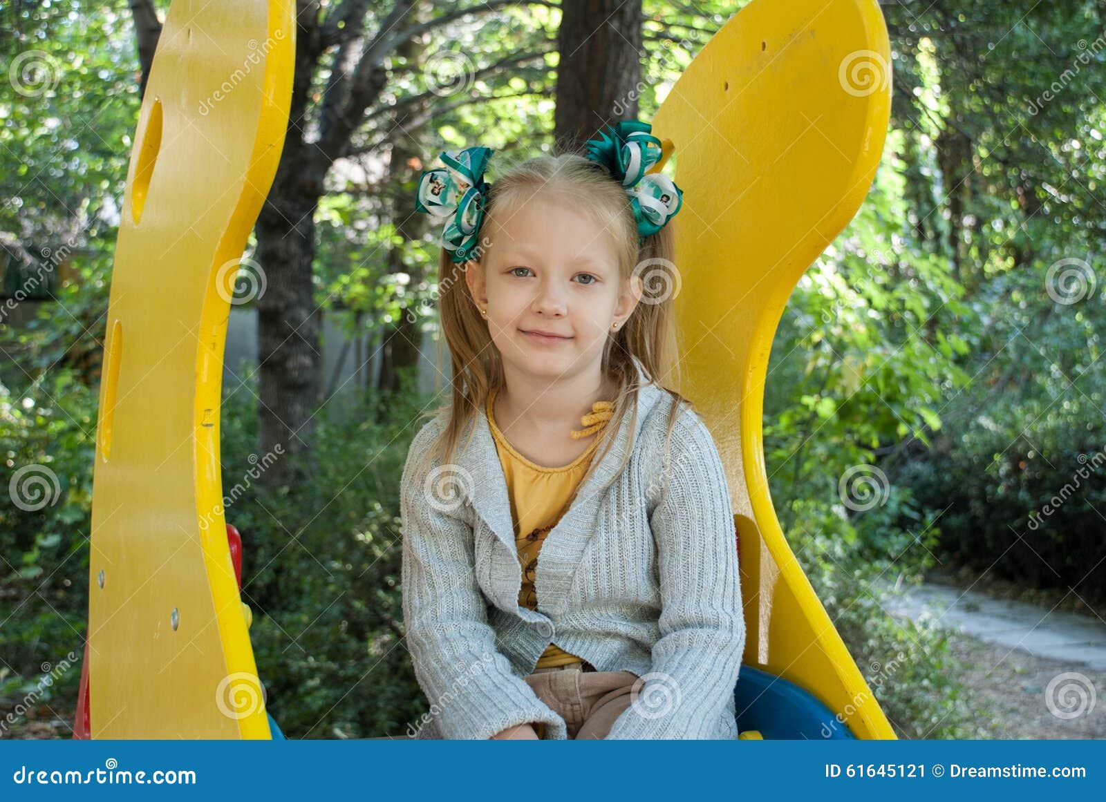 Girl in the kindergarten on the baby hill