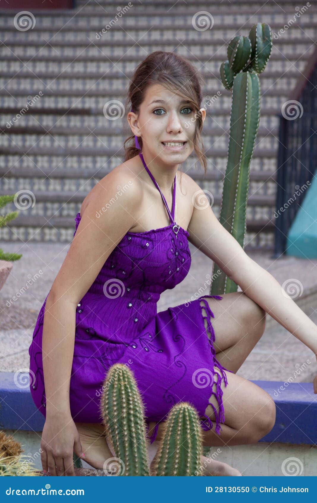 Girl Kneeling in a Garden stock photo. Image of teenager 28130550