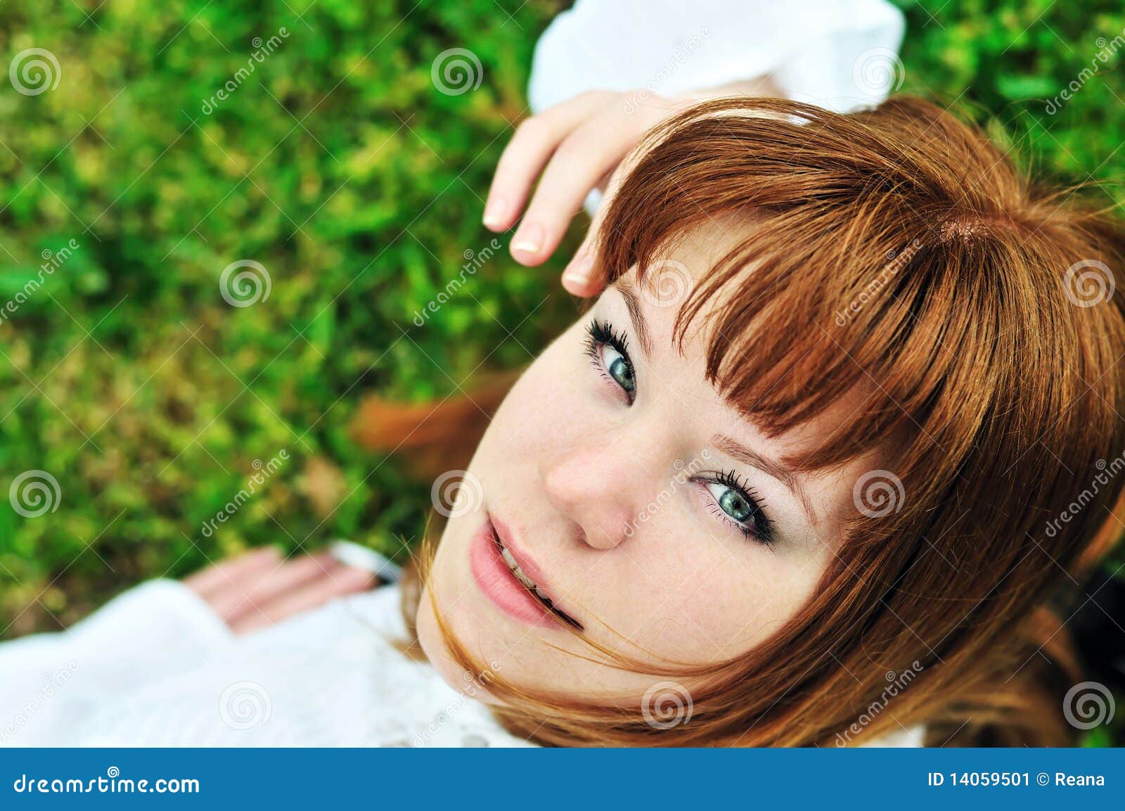 girl laying on the spring meadow