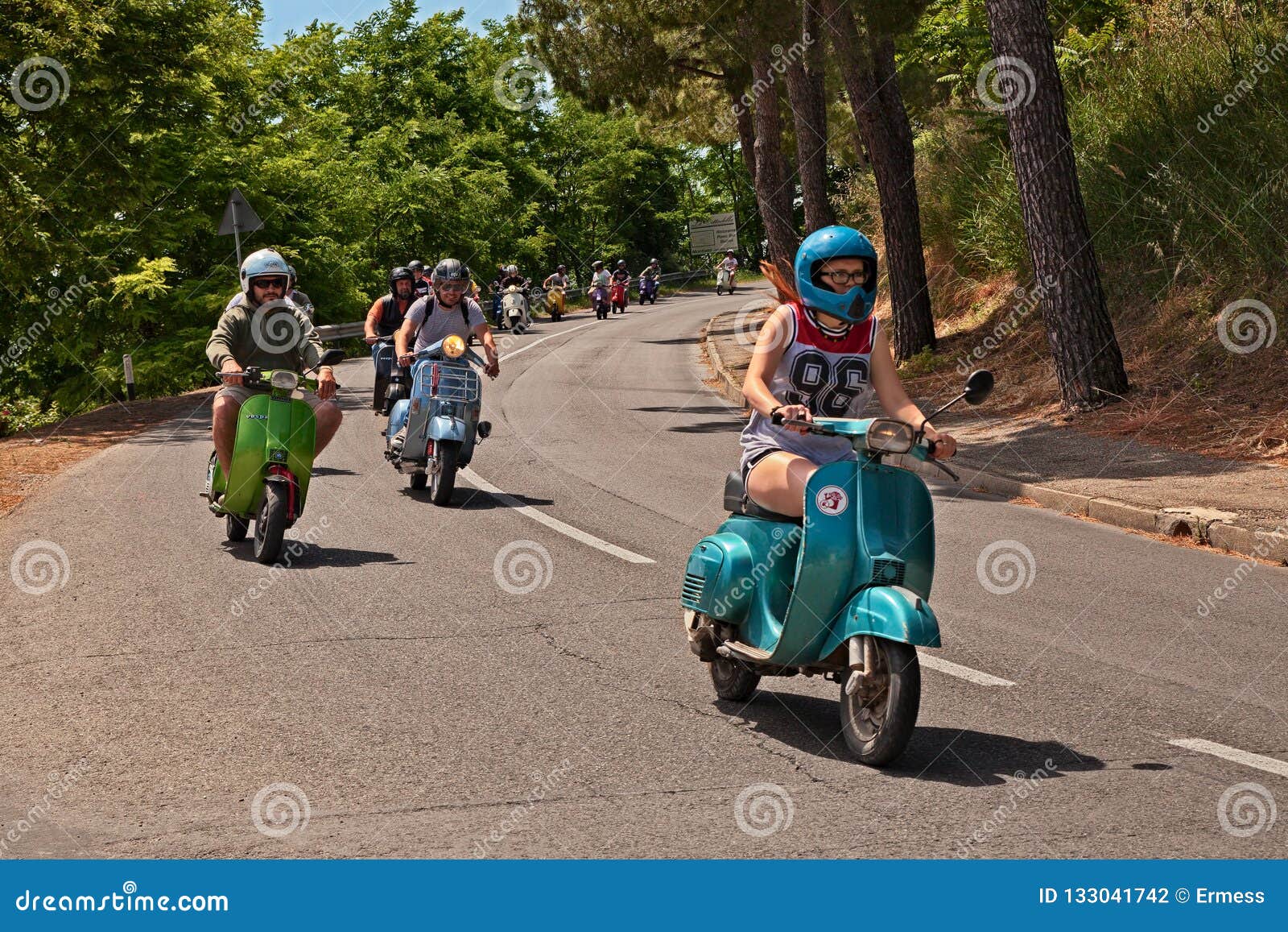 girl riding vespa scooter