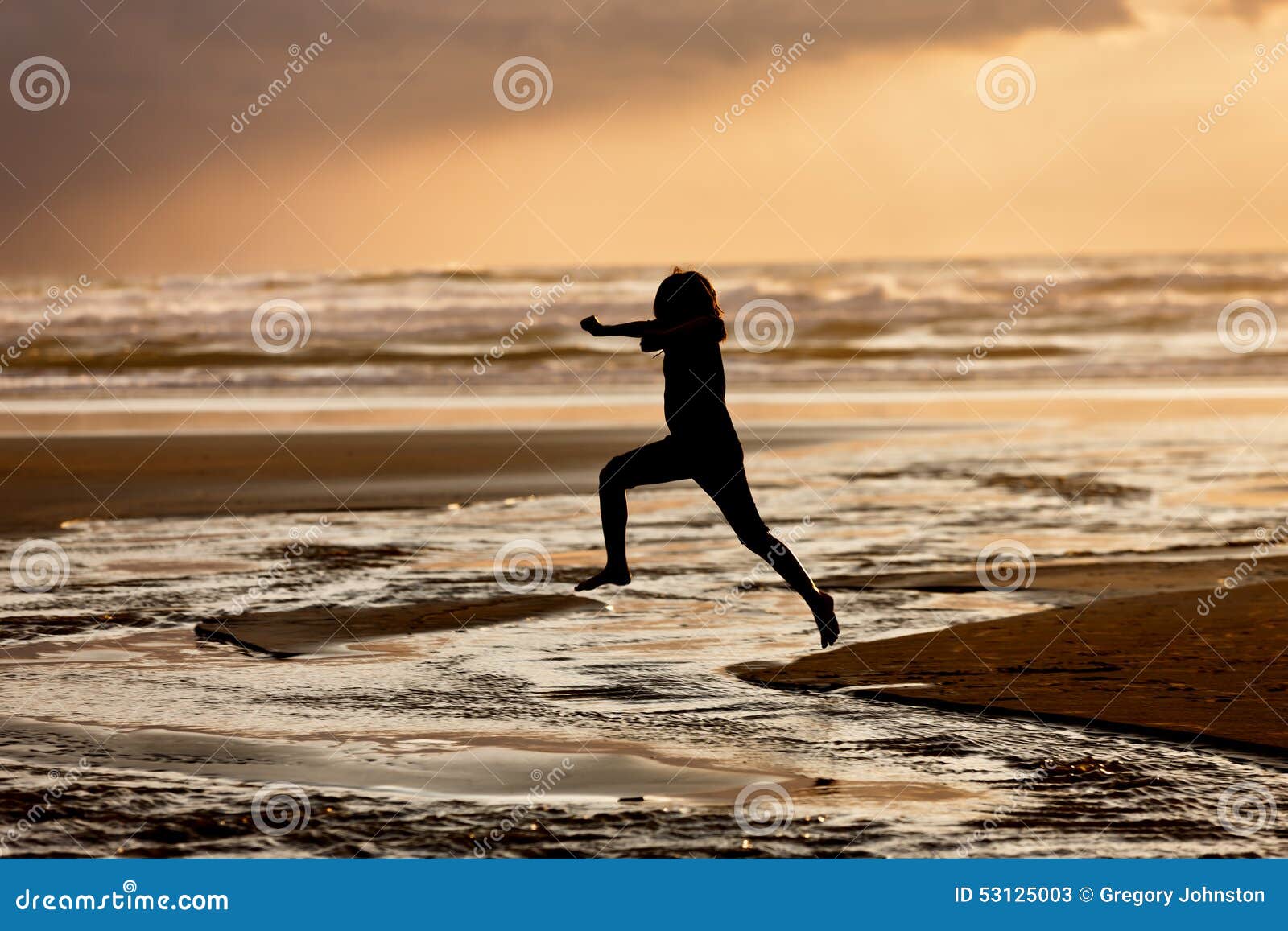 girl leaps into the water.