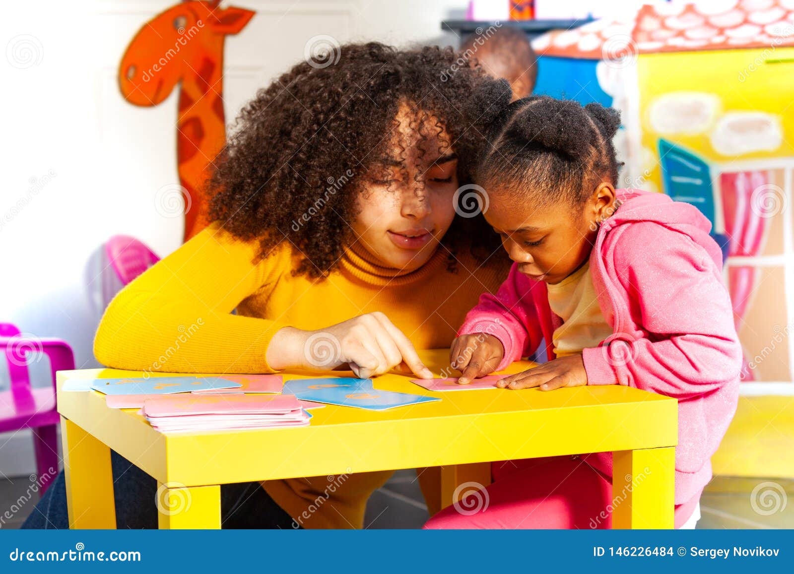 girl learn cursive alphabet by tactile cards