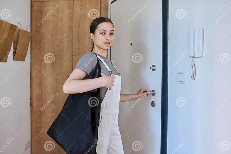 Girl Leaving Apartment, Standing Near Front Door Stock Photo - Image of ...