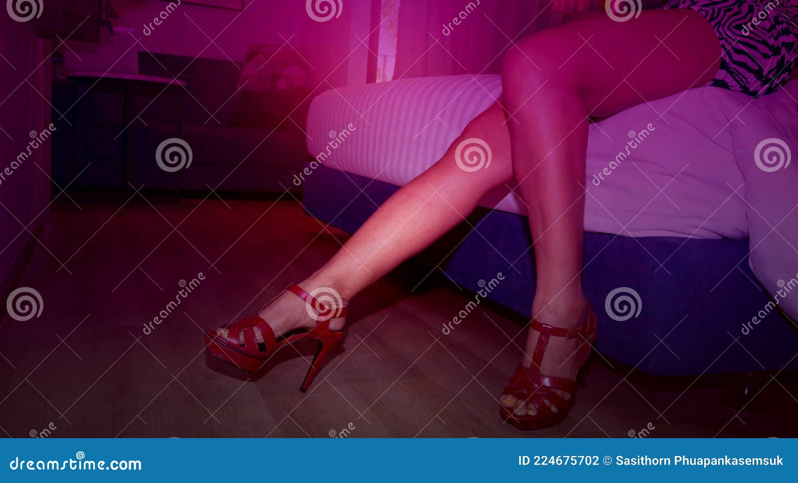 Girl Legs Which Passed Out on Bed with High Heels in Party at Hotel As Paid Sex or Prostitution Concept Stock Photo pic