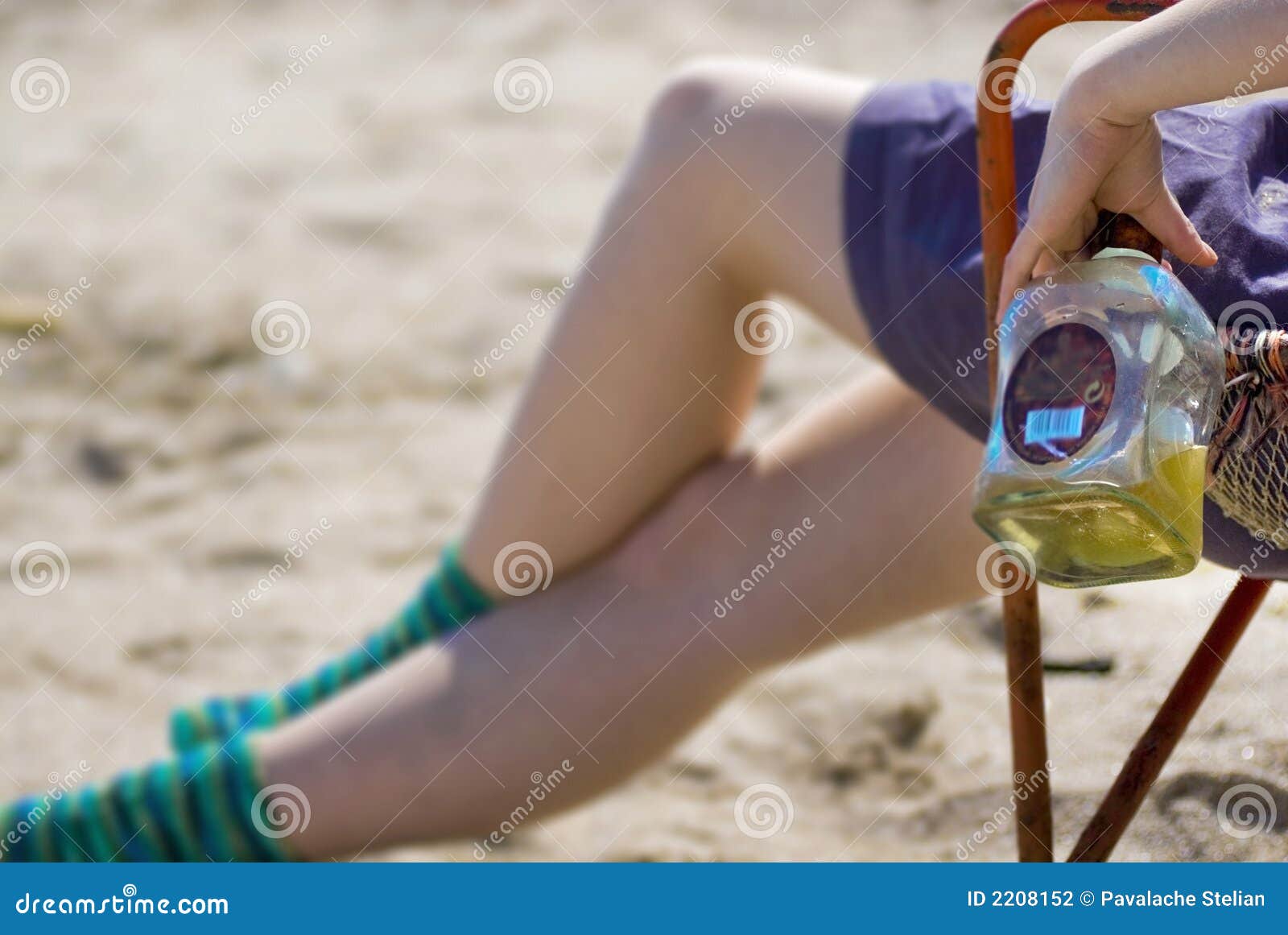 Girl with liquor on beach stock photo. Image of female 2208152