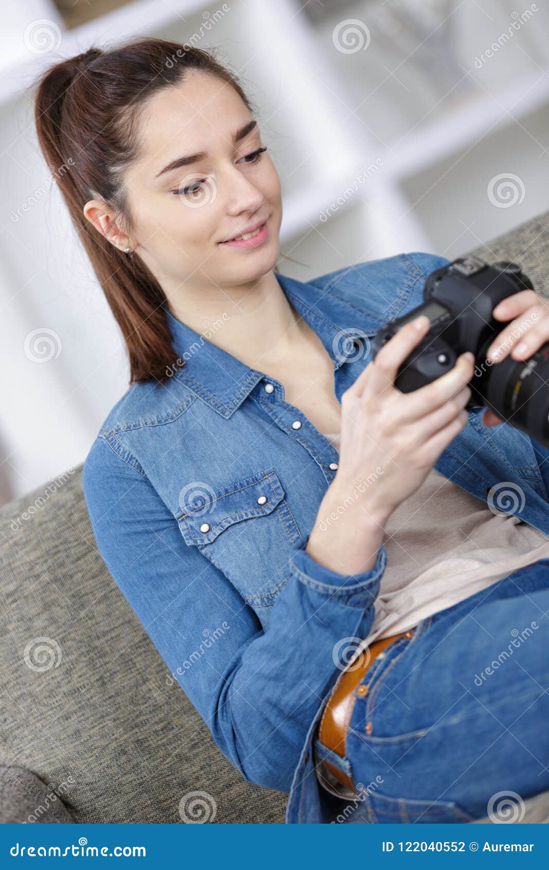 girl looking at digital camera`s display
