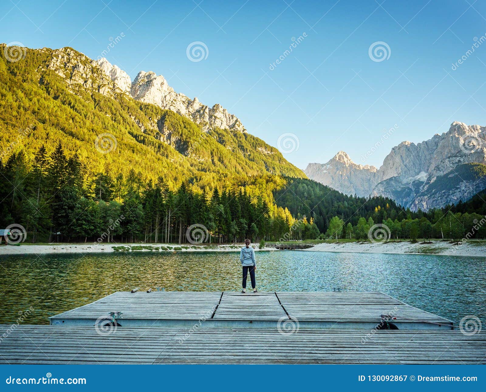 Girl Looking Over Kranjska Gora Lake into the Mountains, Slovenia Stock ...