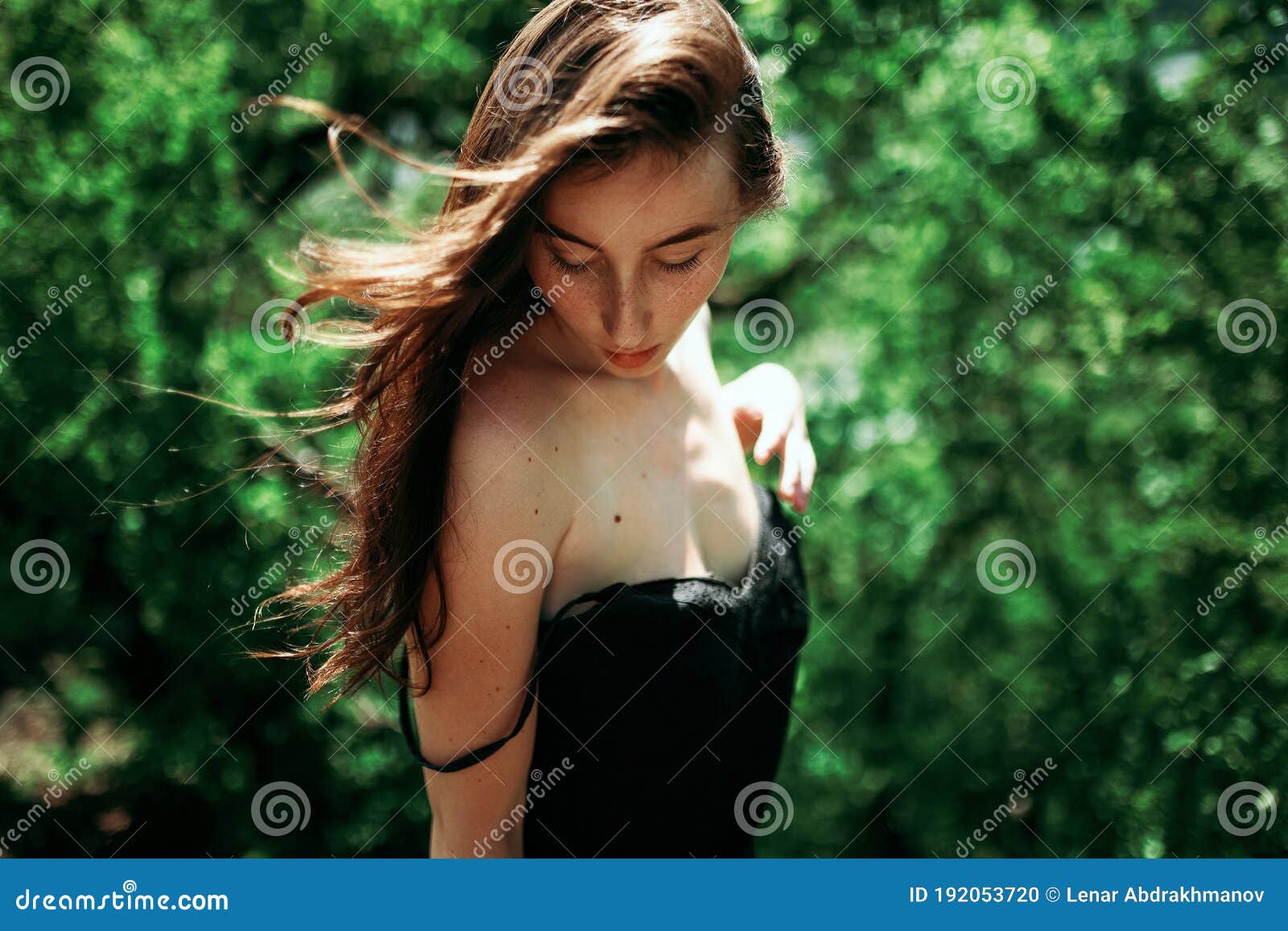 https://thumbs.dreamstime.com/z/girl-looks-cute-ground-black-dress-forest-sochi-192053720.jpg
