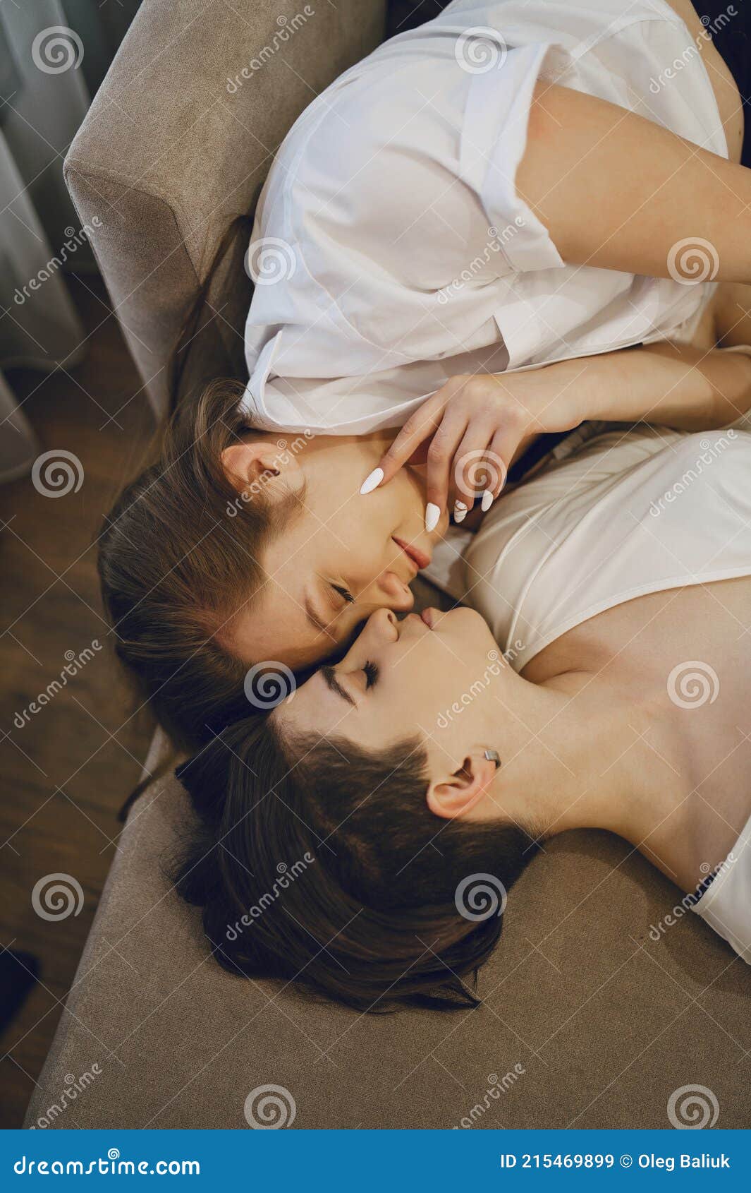 Lesbians Kissing On Couch