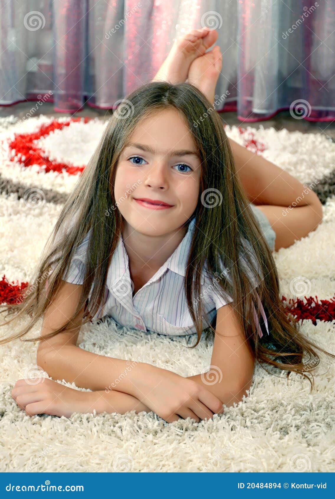 Girl lying on a carpet stock photo. Image of portrait 20484894