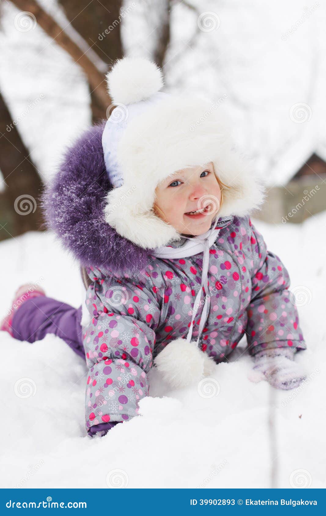 Girl lying in the snow stock image. Image of child, daughter - 39902893